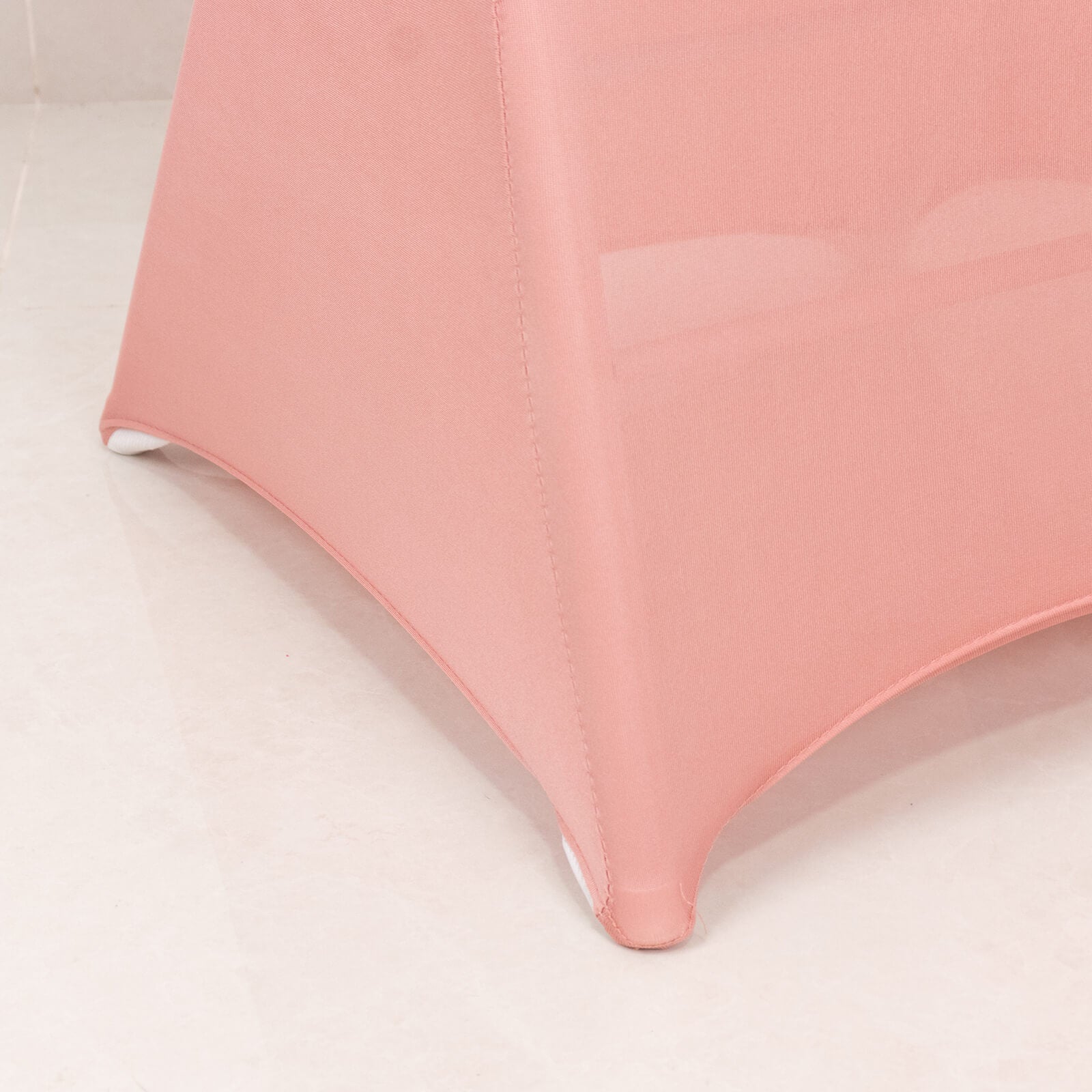 Blush spandex folding chair cover with silver rhinestone sash.