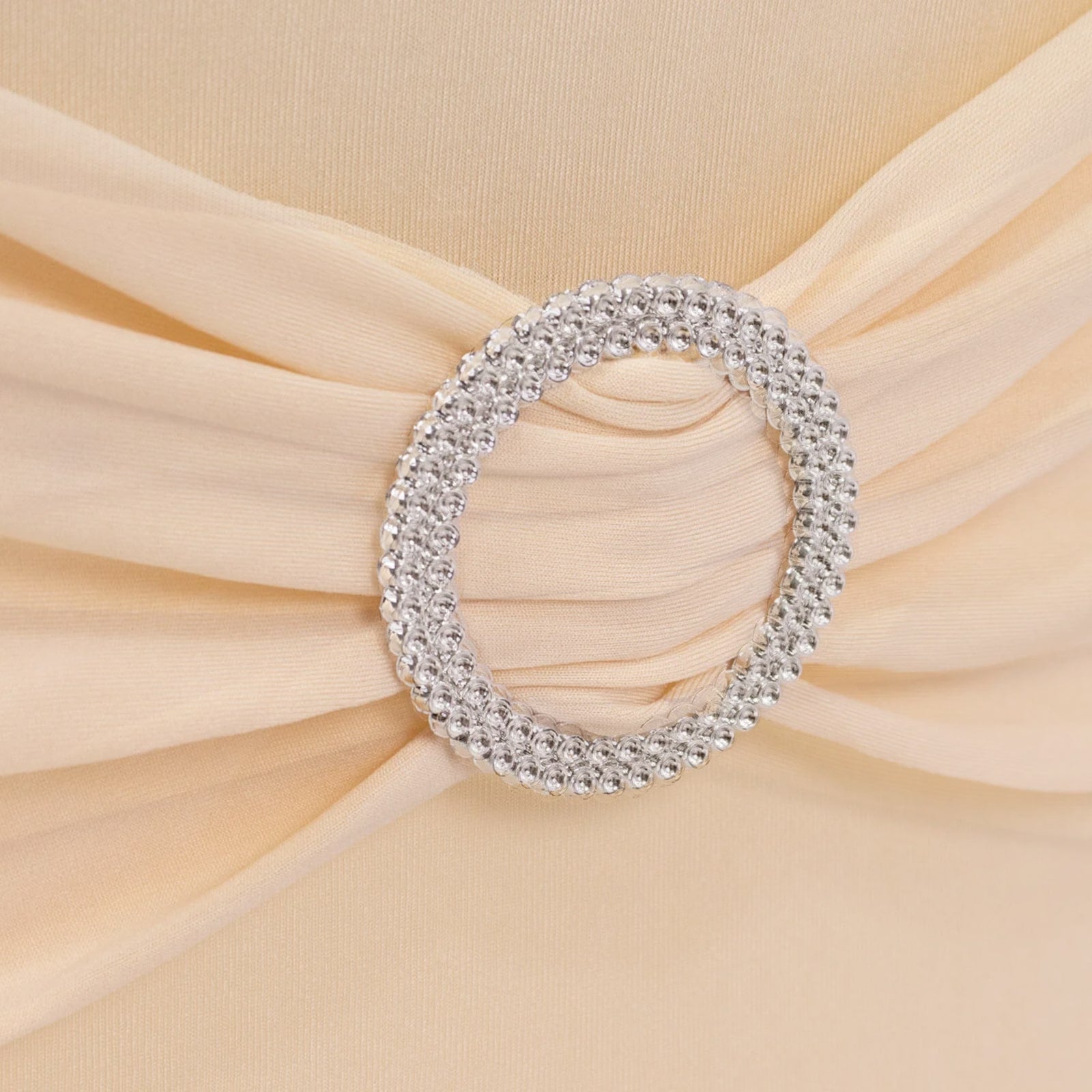 Beige folding chair cover with silver rhinestone sash. #whtbkgd