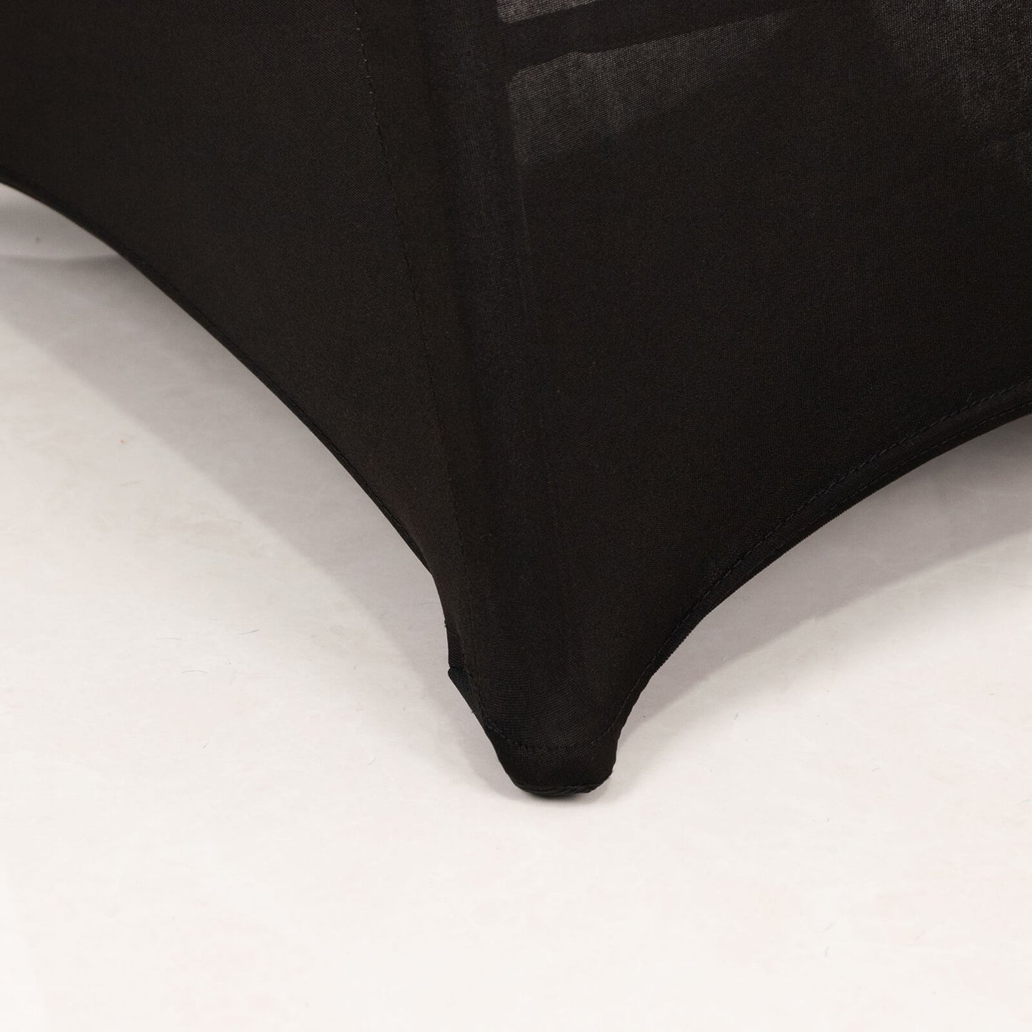Black spandex folding chair cover with rhinestone buckle detail.