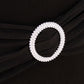 Black spandex chair cover with silver rhinestone buckle detail. #whtbkgd