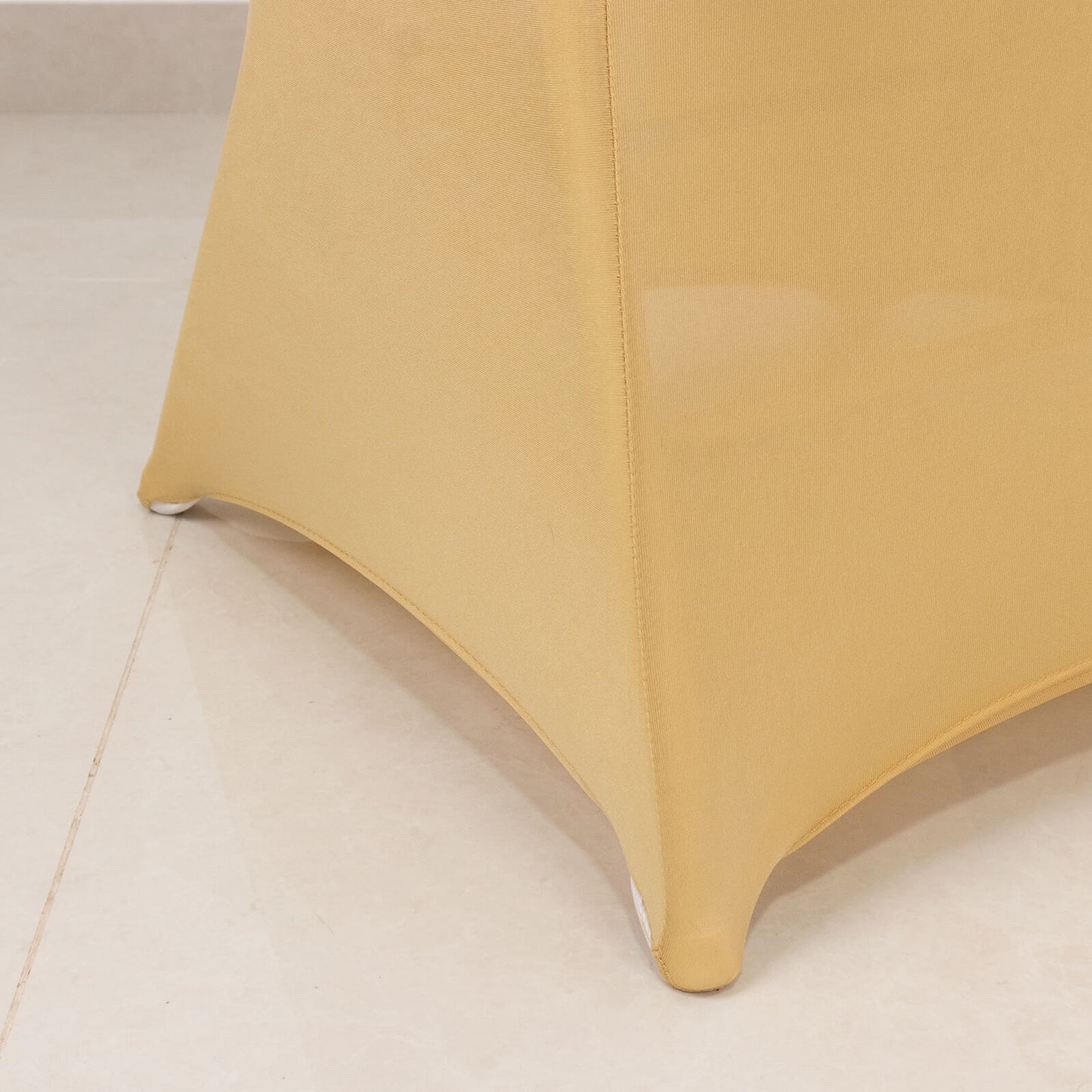 Champagne spandex folding chair cover with silver rhinestone sash.