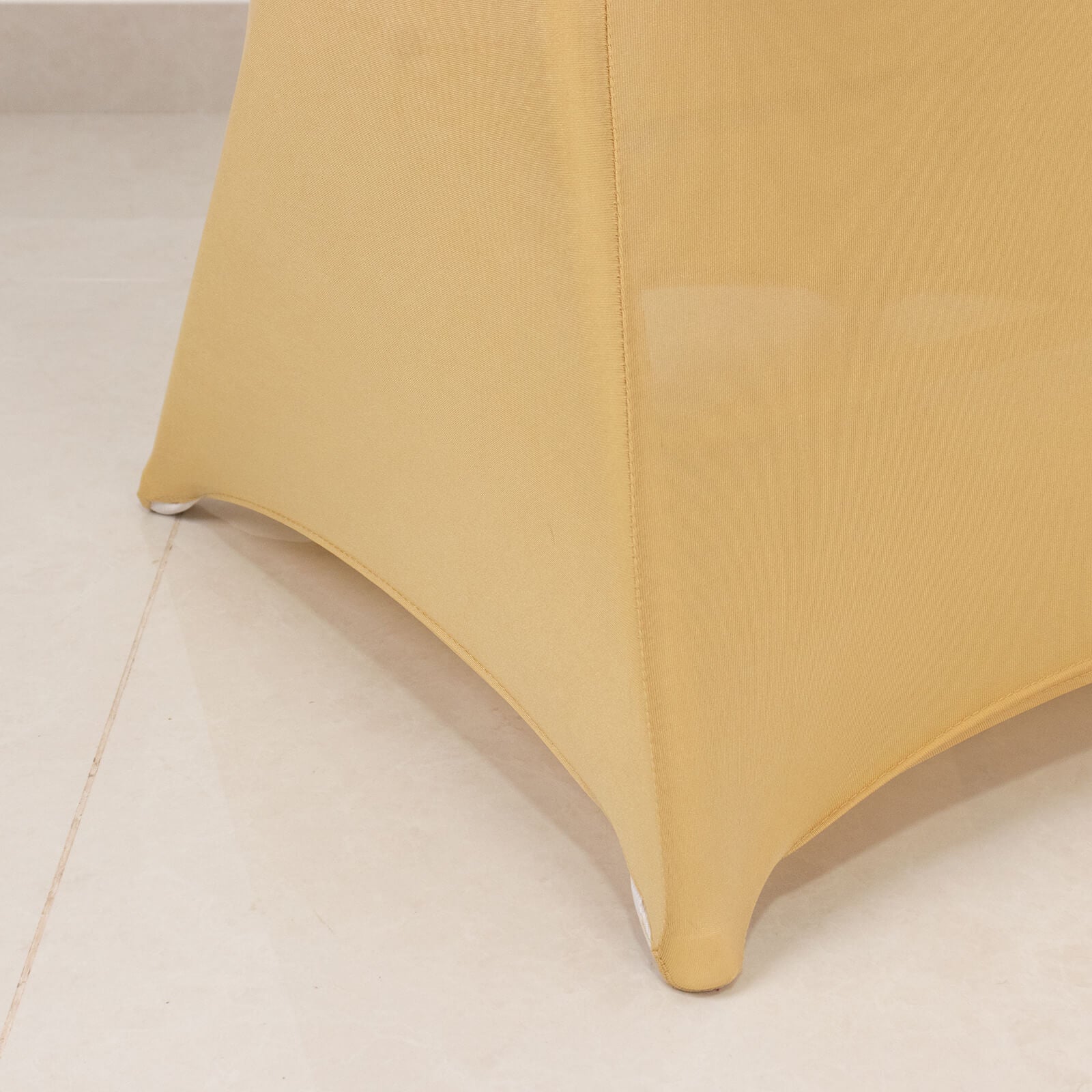 Champagne spandex folding chair cover with silver rhinestone sash.