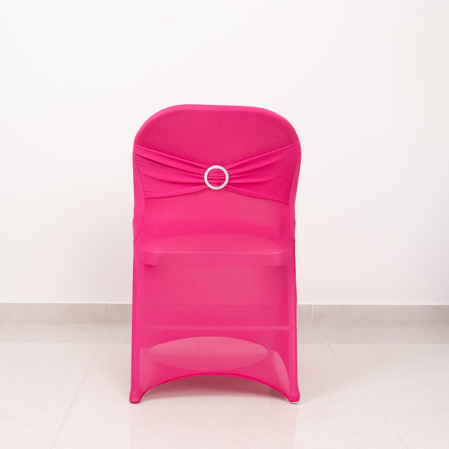 Fuchsia spandex folding chair cover with rhinestone sash.