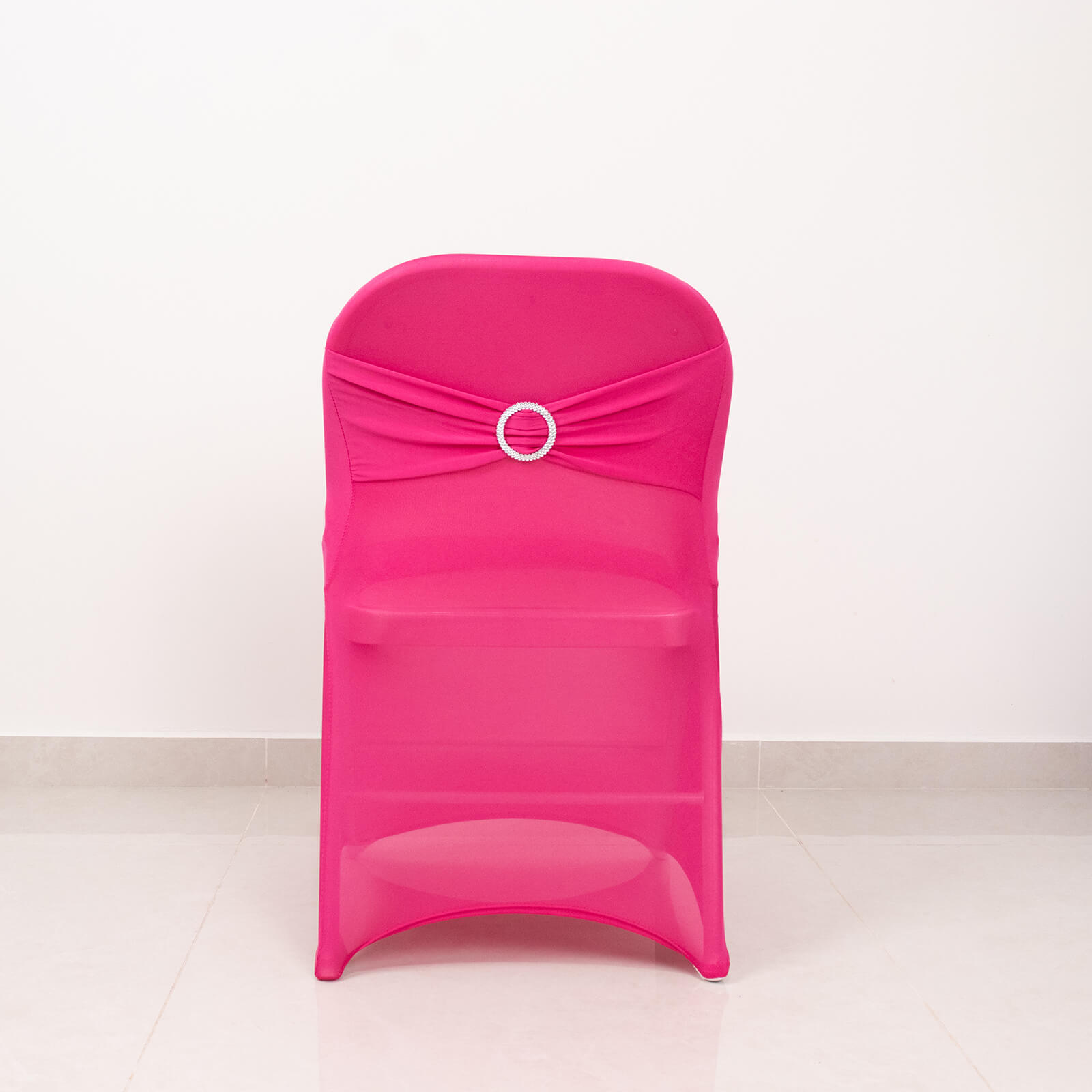 Fuchsia spandex folding chair cover with rhinestone sash.