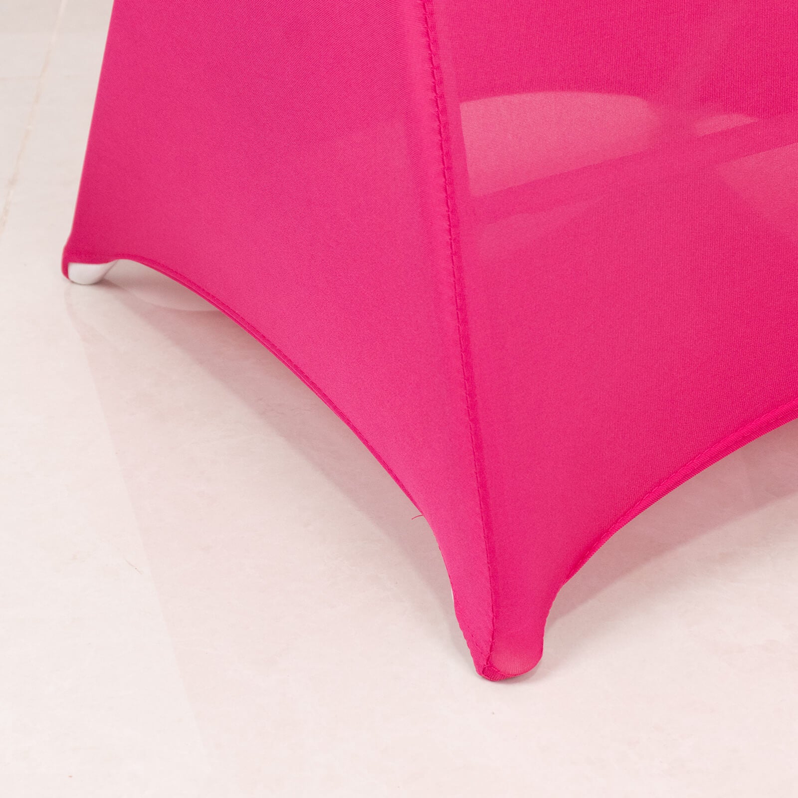 Fuchsia spandex folding chair cover with silver rhinestone sash band.