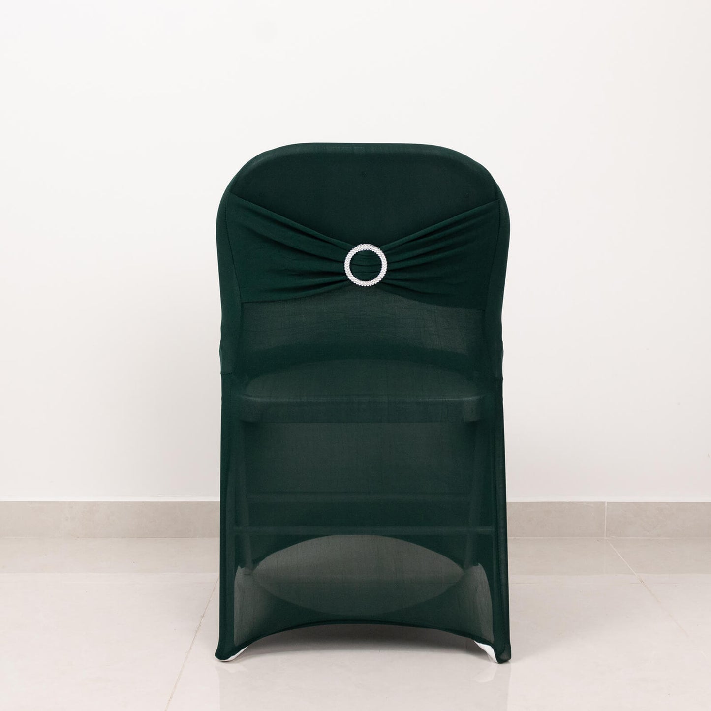 Emerald green spandex folding chair cover with rhinestone sash.