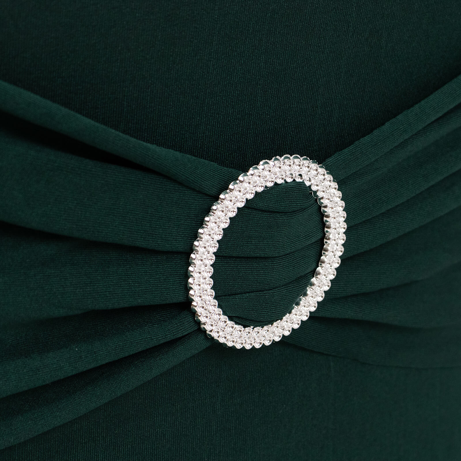 Emerald green chair cover with silver rhinestone buckled sash band.