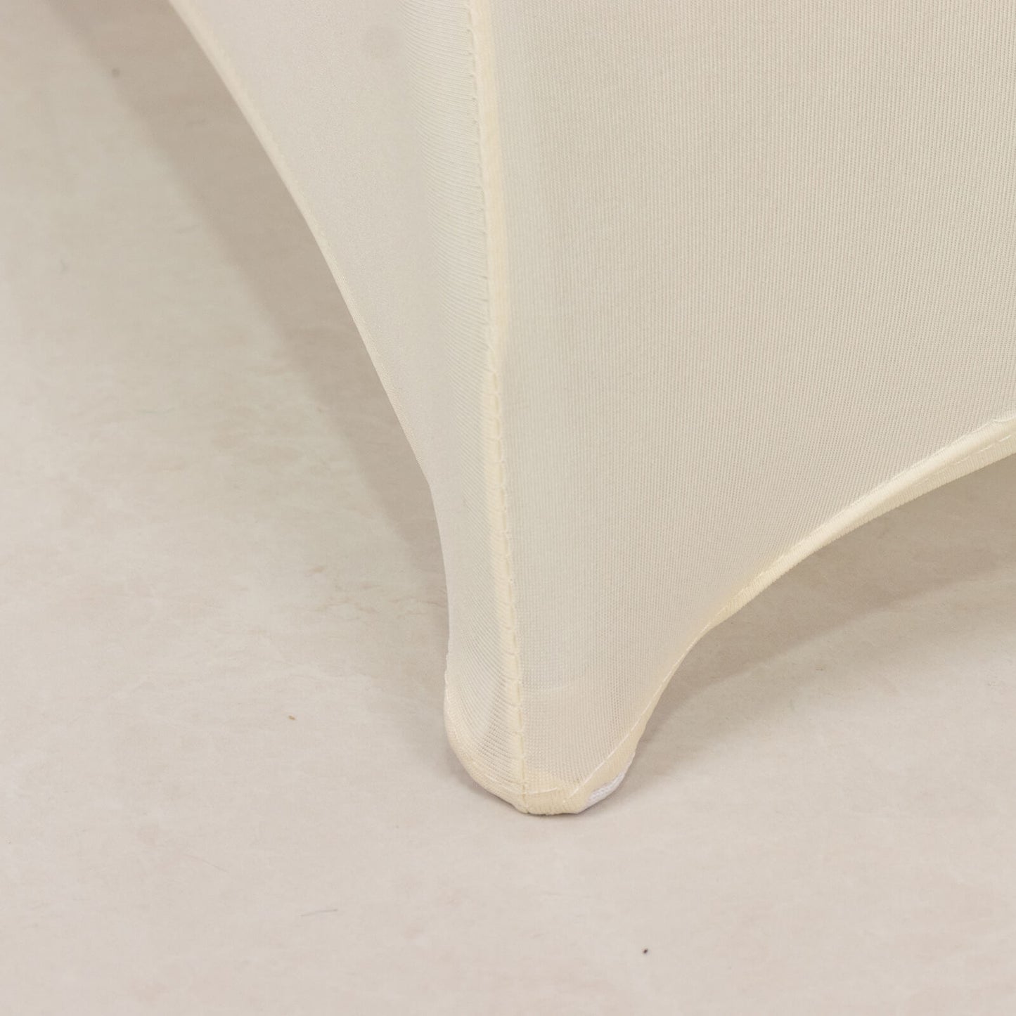 Ivory spandex folding chair cover with silver rhinestone sash.