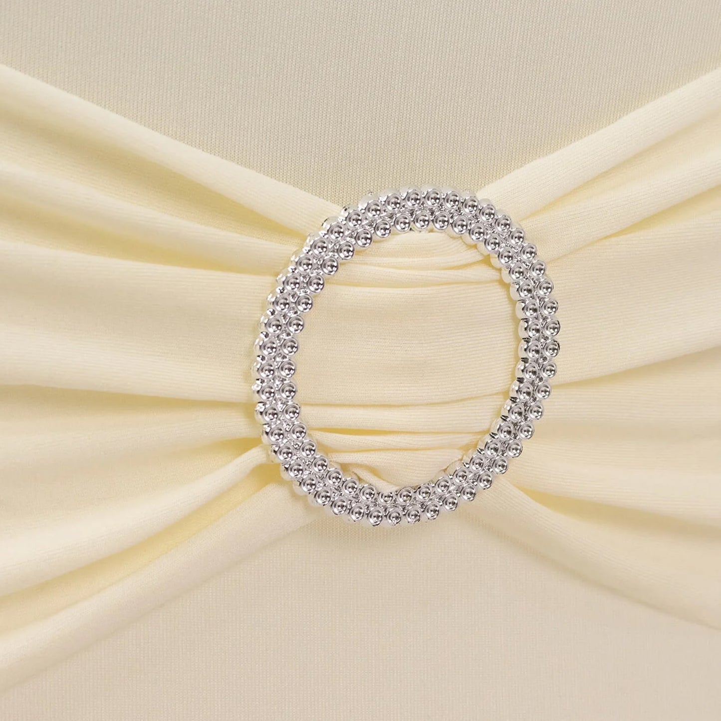 Ivory spandex folding chair cover with silver rhinestone sash. #whtbkgd