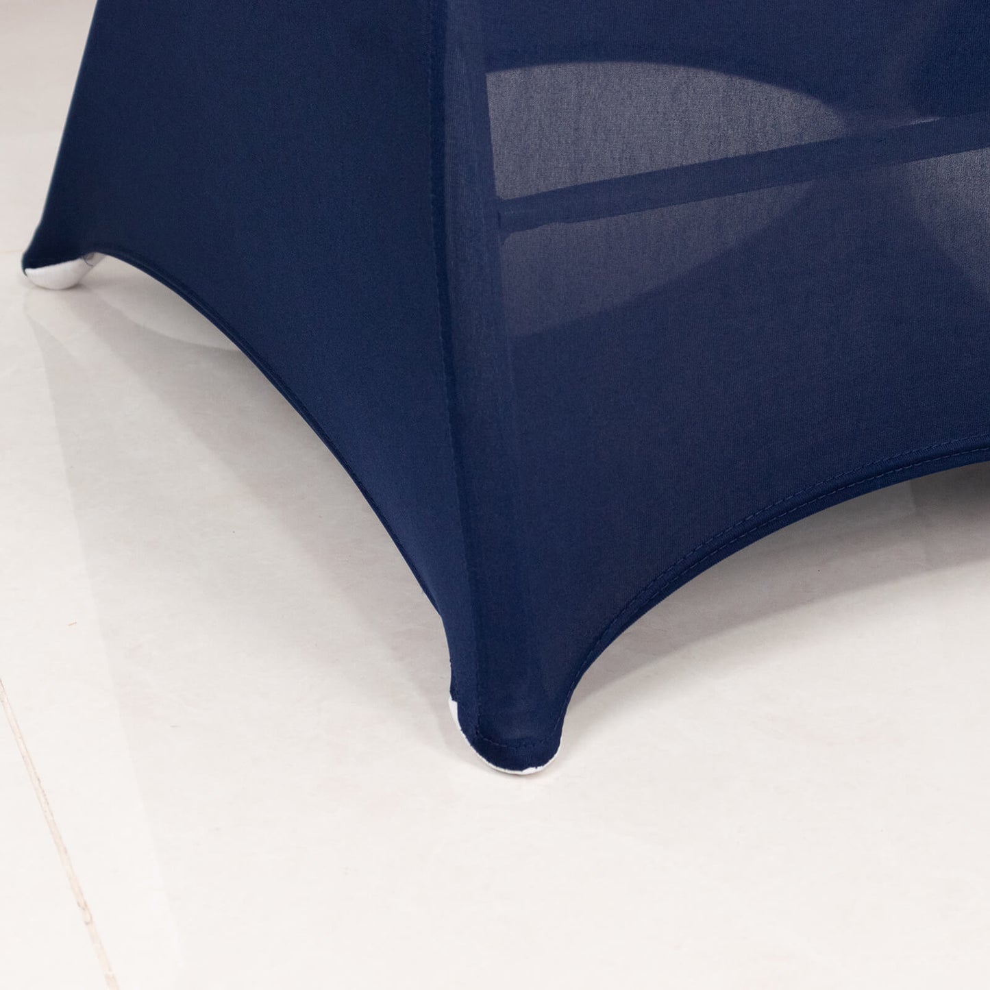 Navy blue spandex folding chair cover with rhinestone sash band.