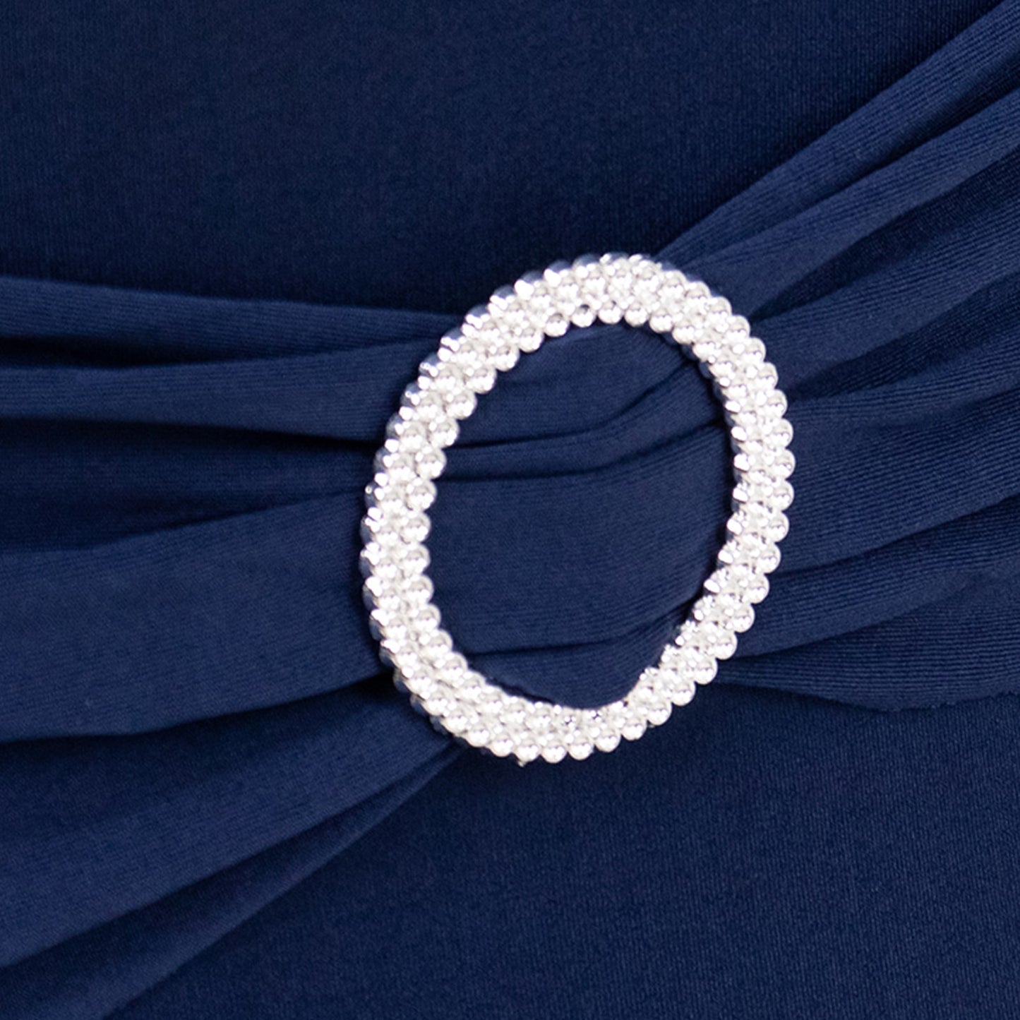 Navy blue spandex chair cover with silver rhinestone buckle detail. #whtbkgd