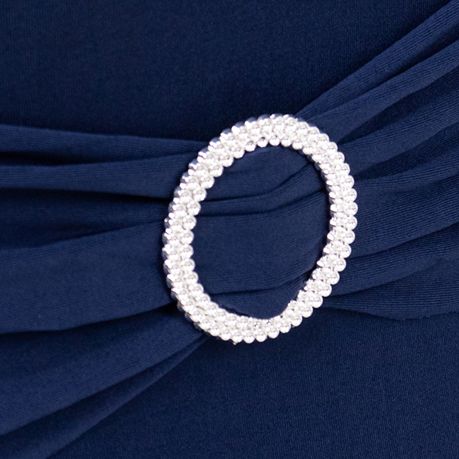 Navy blue spandex chair cover with silver rhinestone buckle detail. #whtbkgd