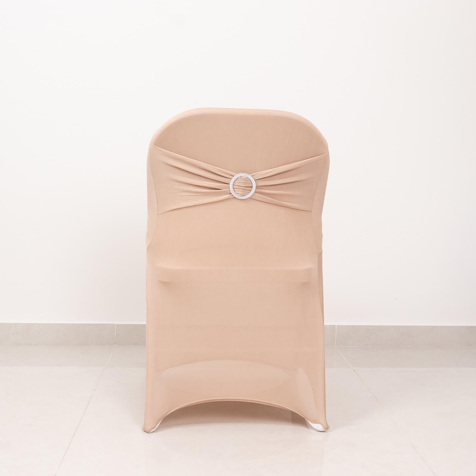 Nude spandex folding chair cover with rhinestone buckle sash.