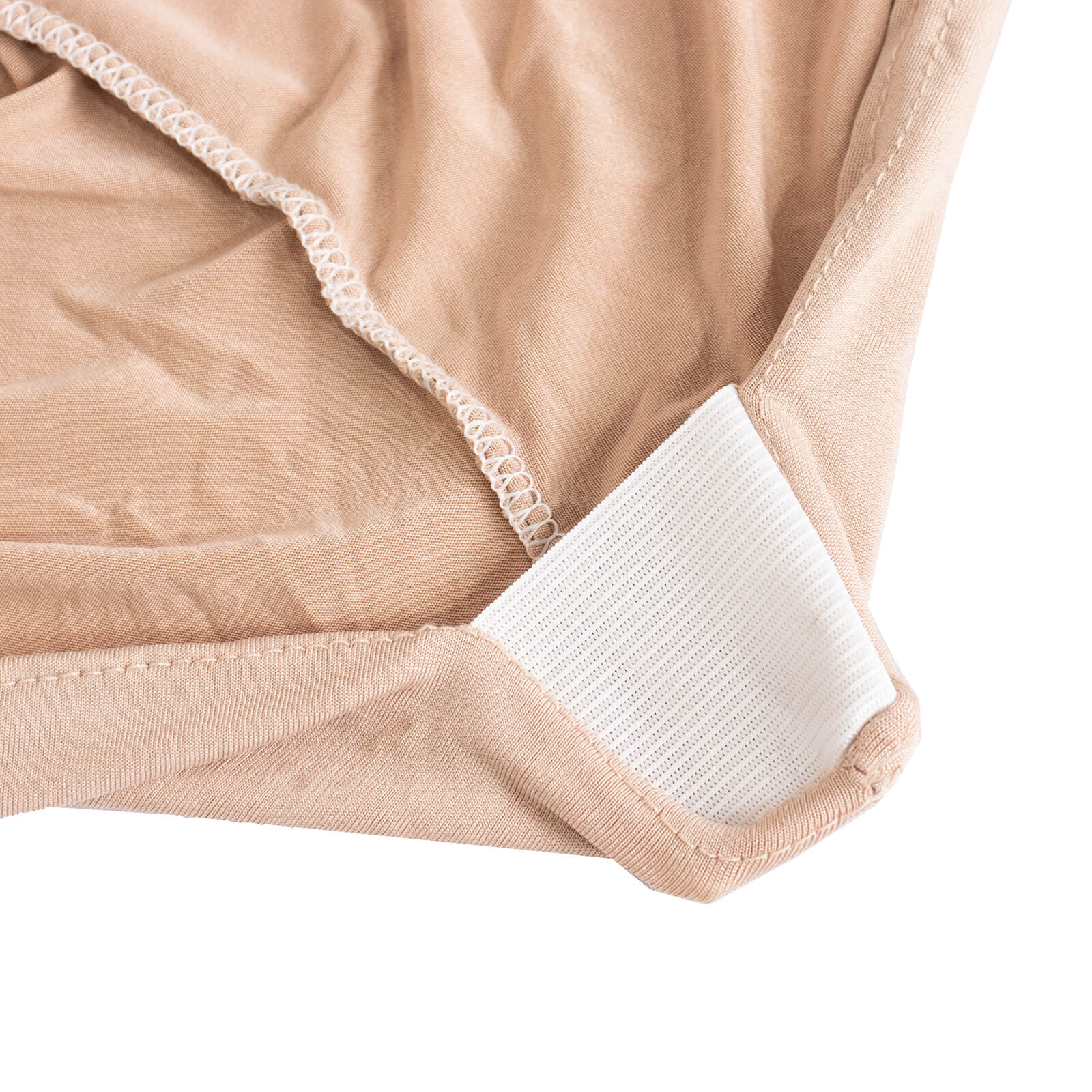 Nude spandex chair cover with silver rhinestone sash detail.