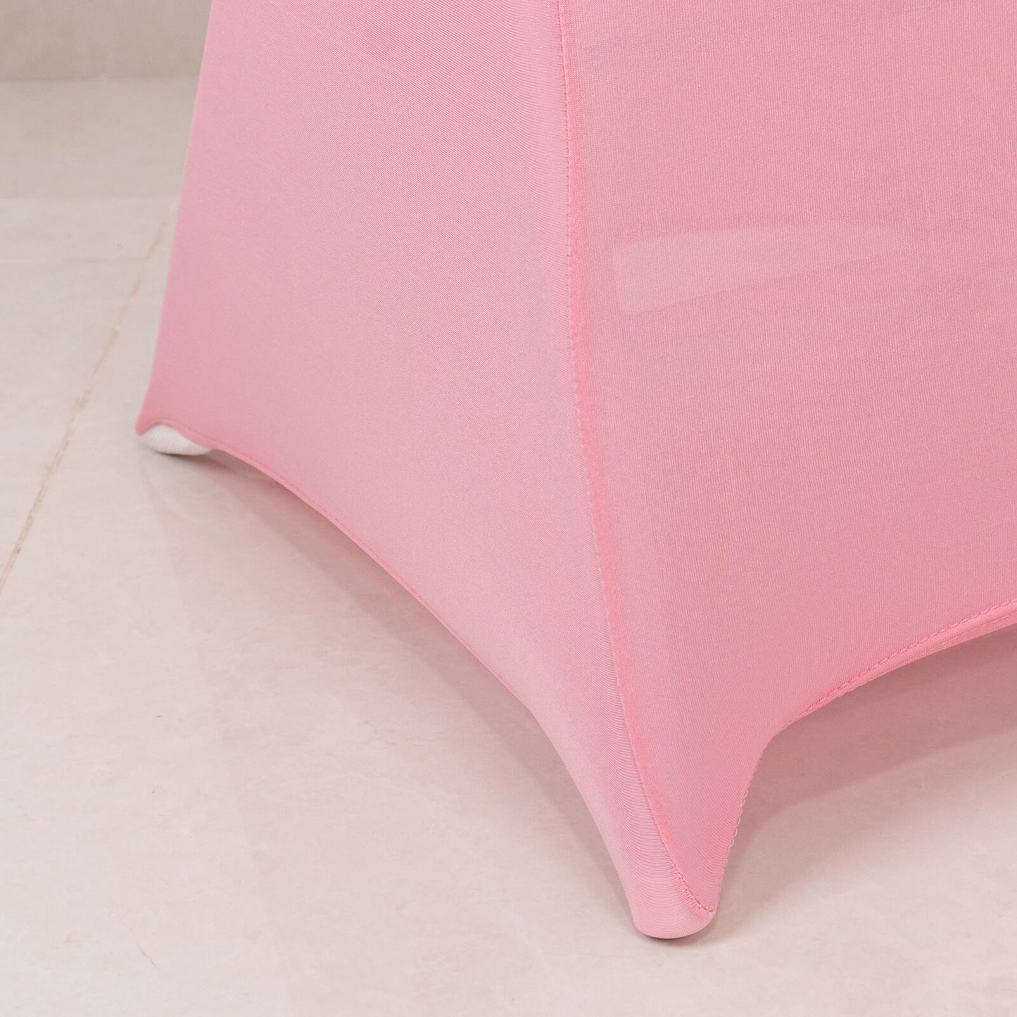 Pink spandex chair cover with silver rhinestone sash band.