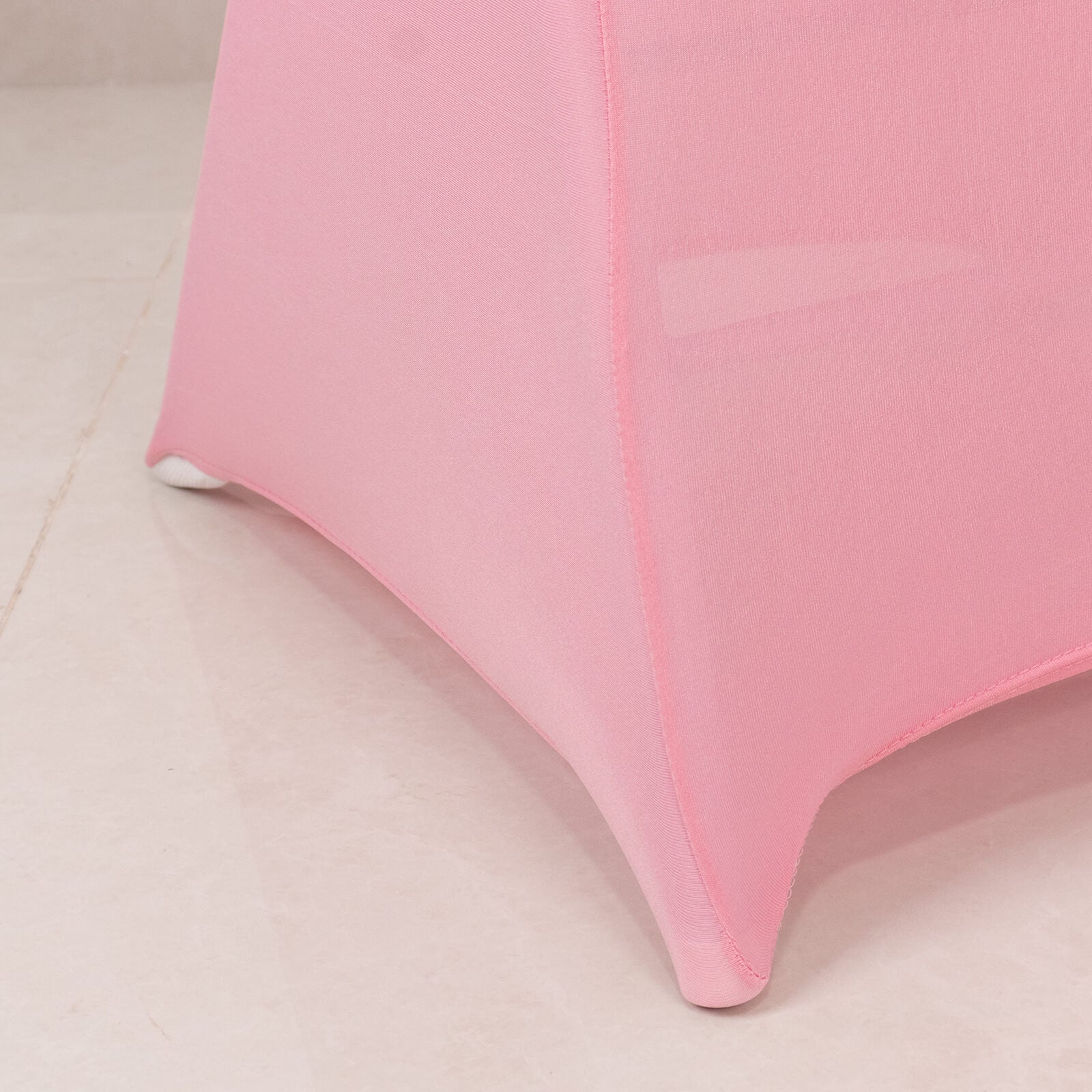 Pink spandex chair cover with silver rhinestone sash band.