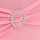 Pink spandex chair cover with silver rhinestone buckle detail.