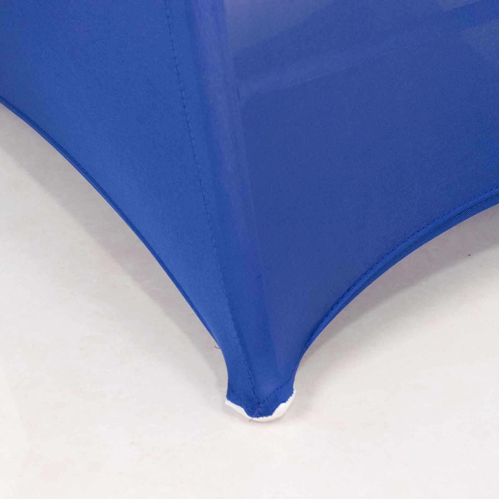 Royal blue spandex folding chair cover with rhinestone sash.