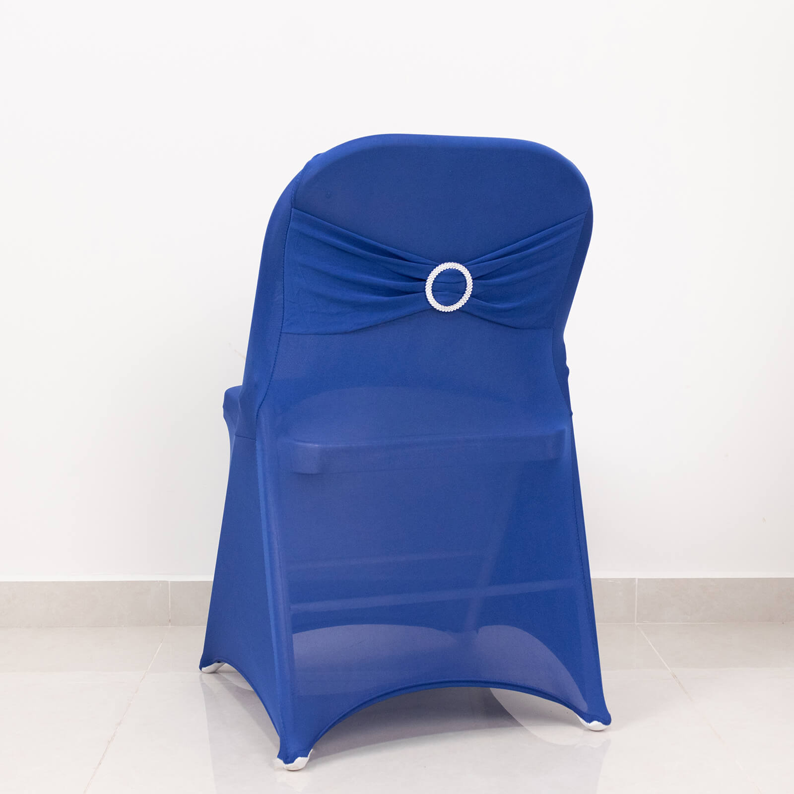 Royal blue folding chair cover with silver rhinestone buckled sash band.