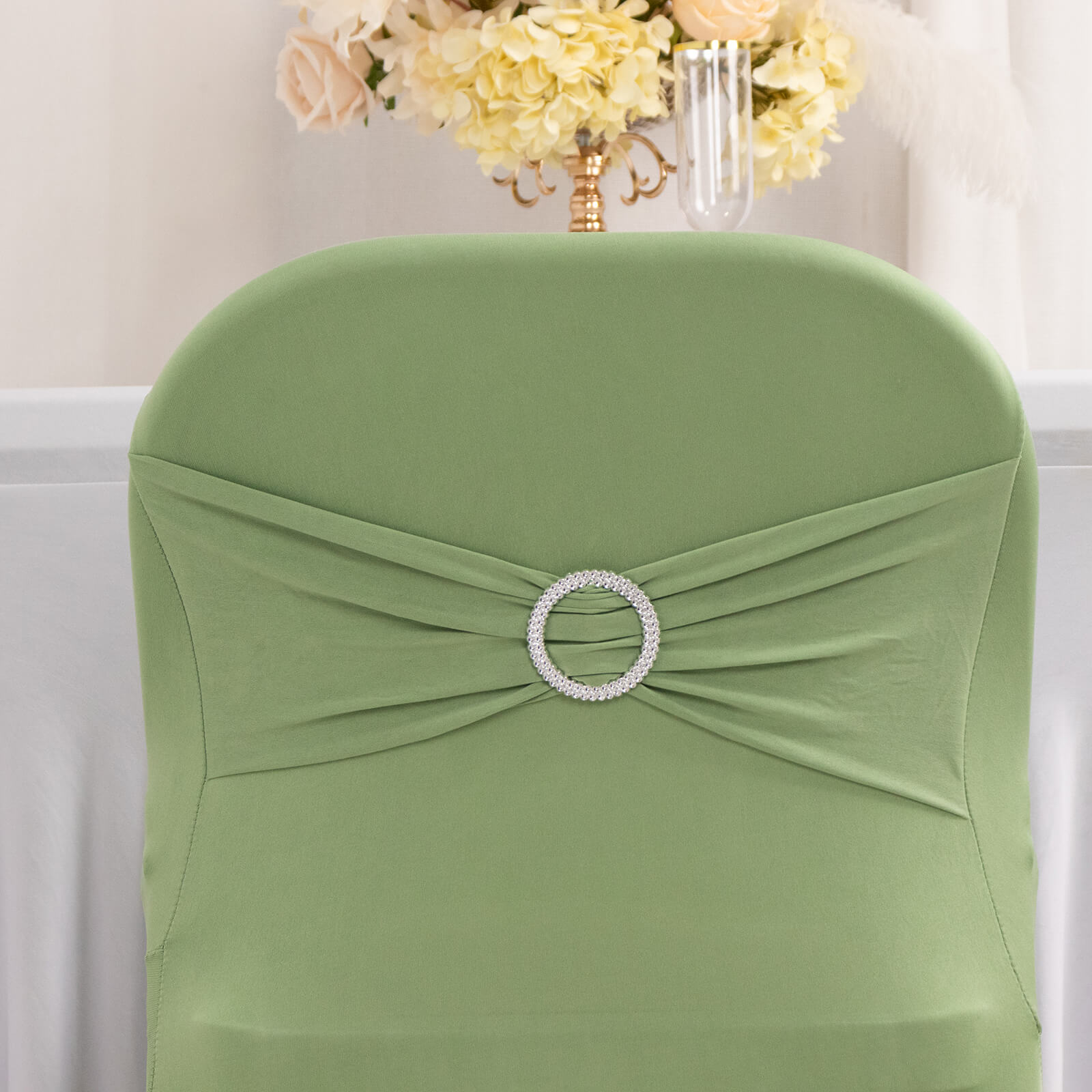 Sage green folding chair cover with silver rhinestone buckle.