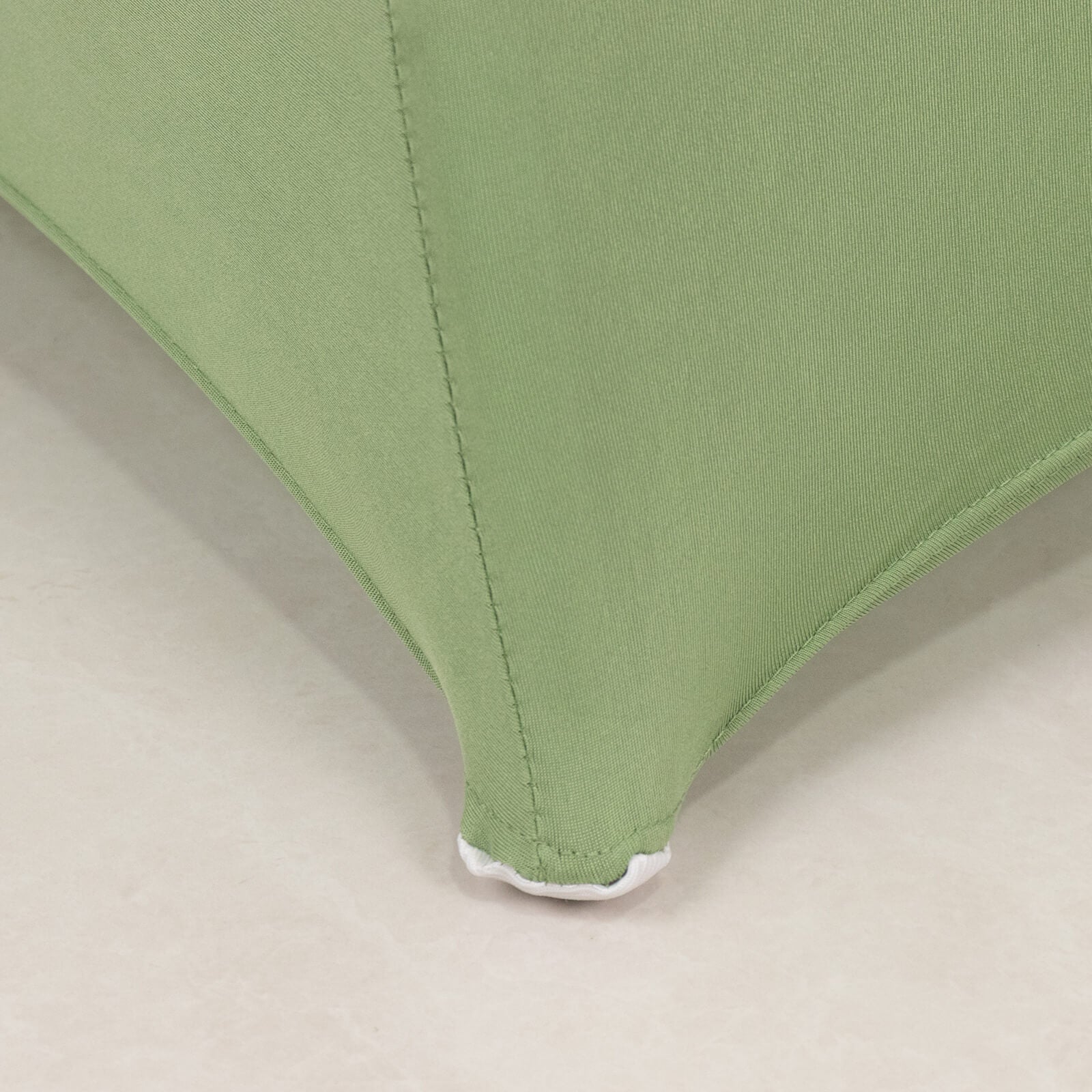 Sage green spandex folding chair cover with rhinestone sash.