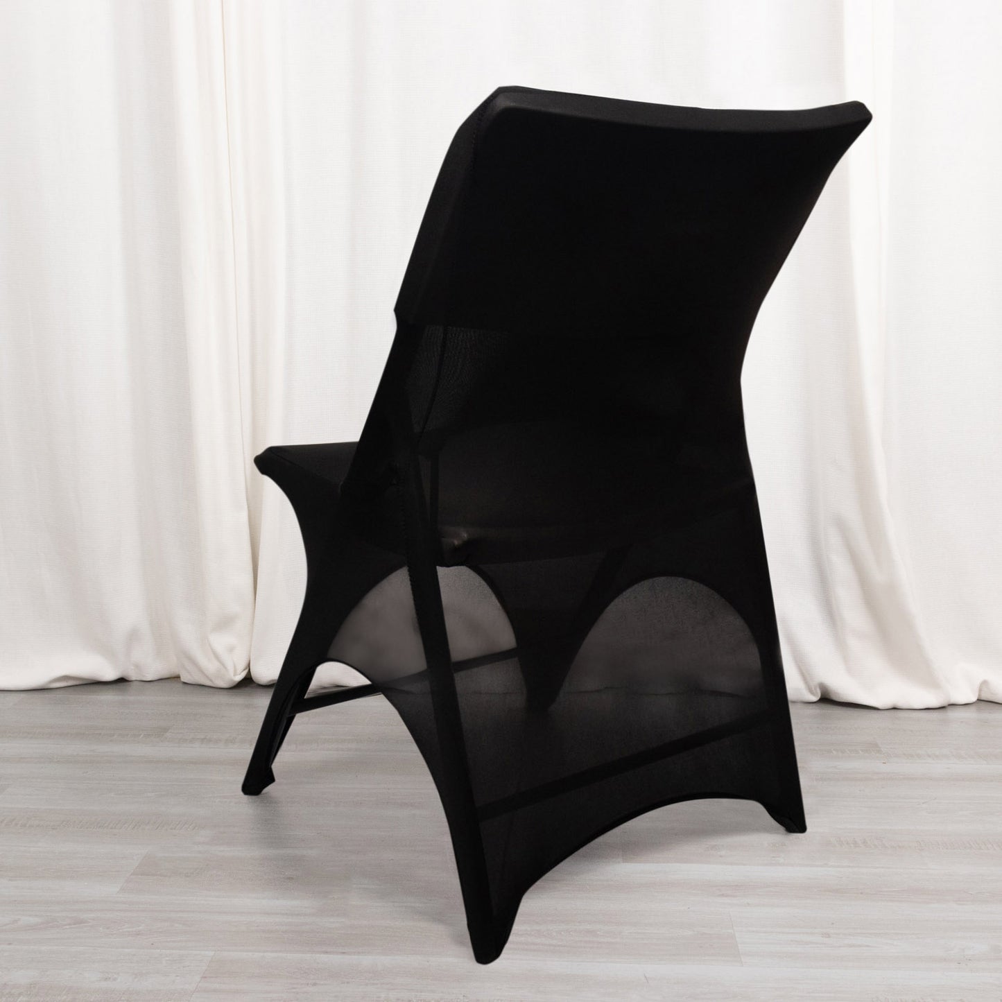 Black spandex wedding chair cover with foot pockets and 3-way open arch.