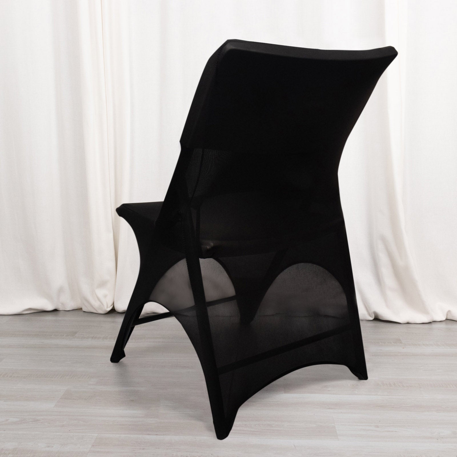 Black spandex wedding chair cover with foot pockets and 3-way open arch.