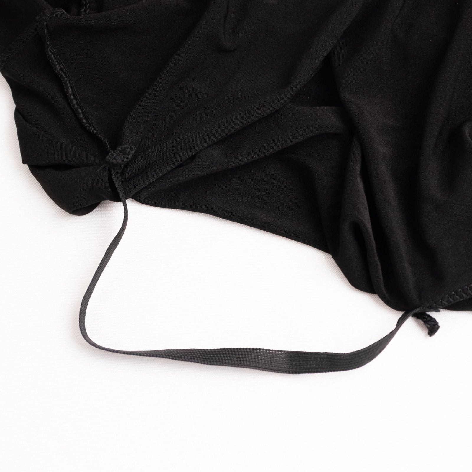 Black spandex wedding chair cover with foot pockets and 3-way open arch.