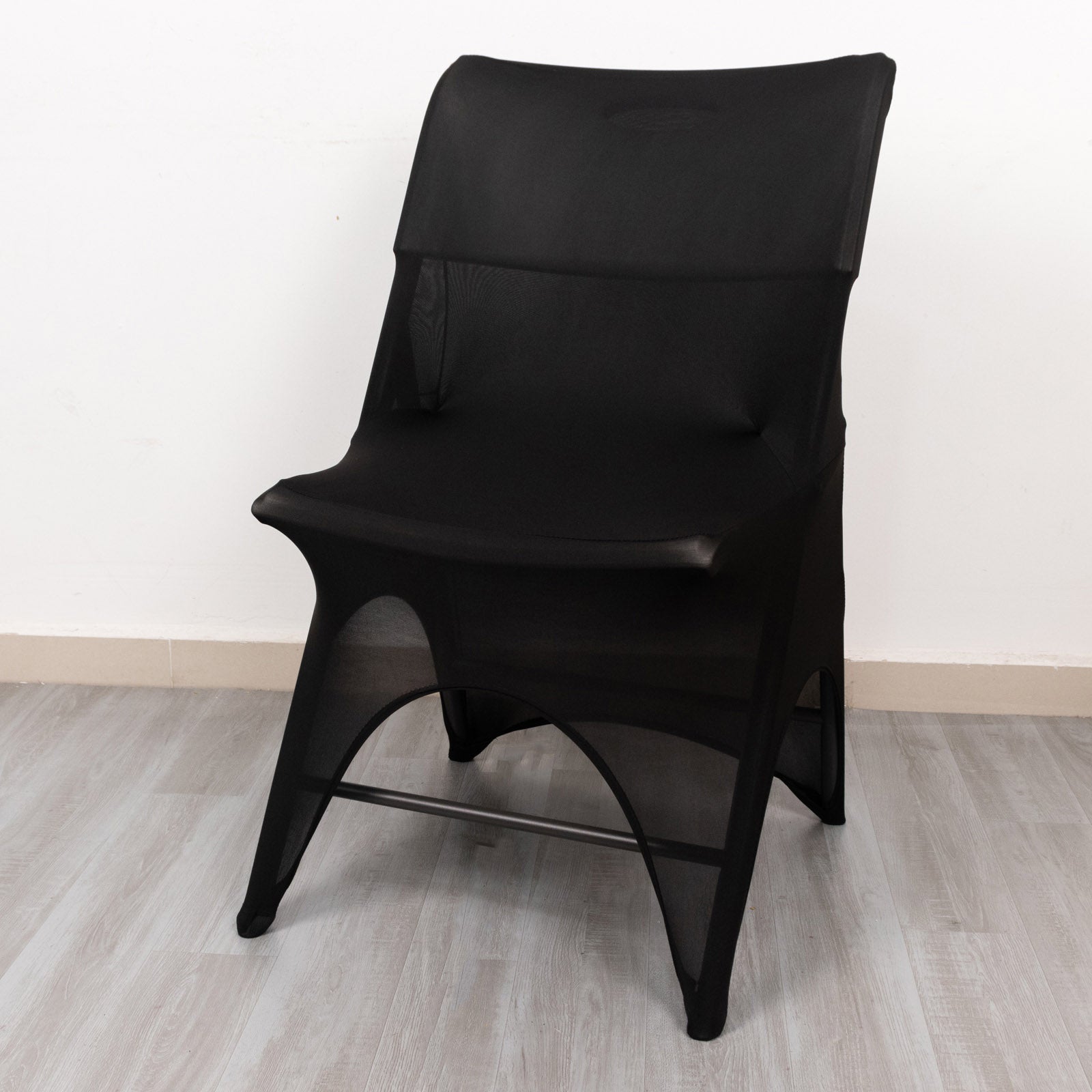 Black spandex wedding chair cover with foot pockets and 3-way open arch design.