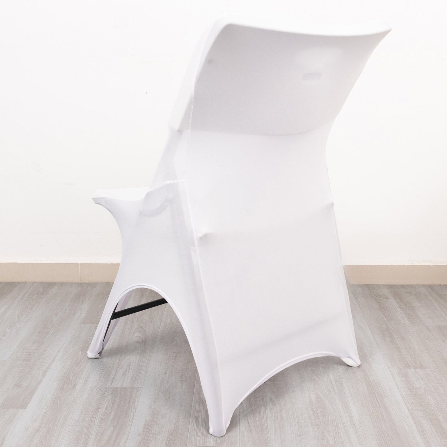 White fitted spandex wedding chair cover with foot pockets.