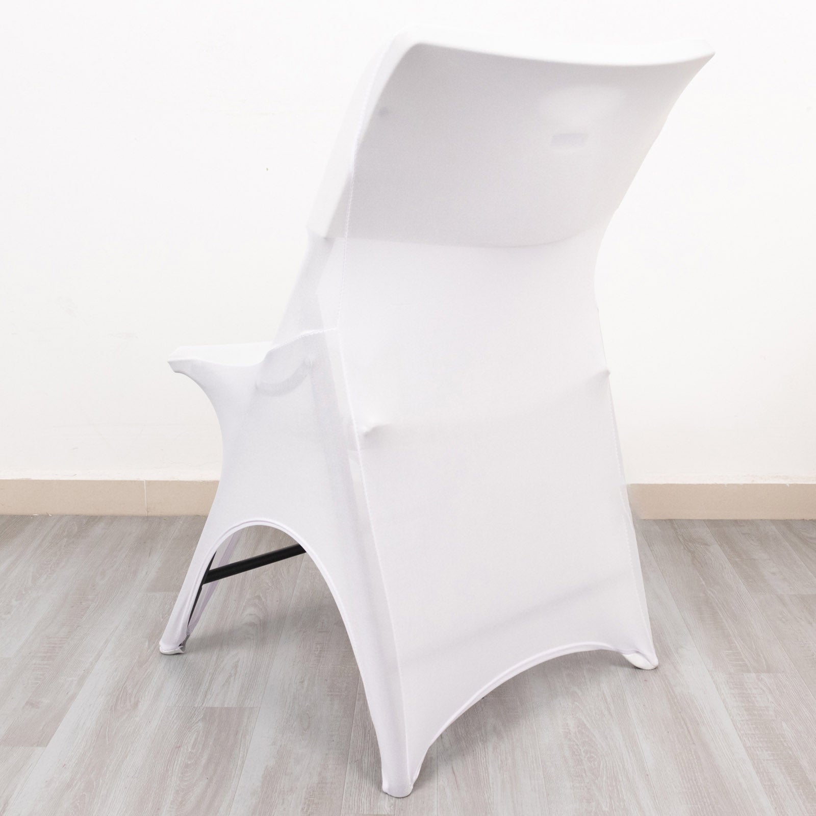 White fitted spandex wedding chair cover with foot pockets.