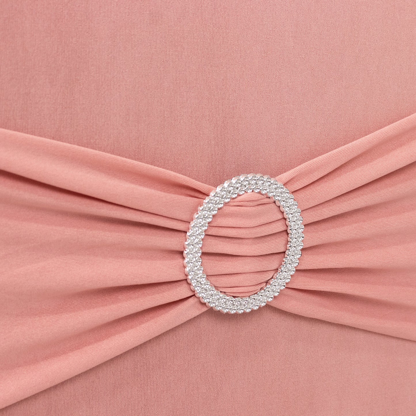 Dusty rose spandex chair cover with silver rhinestone buckle detail.