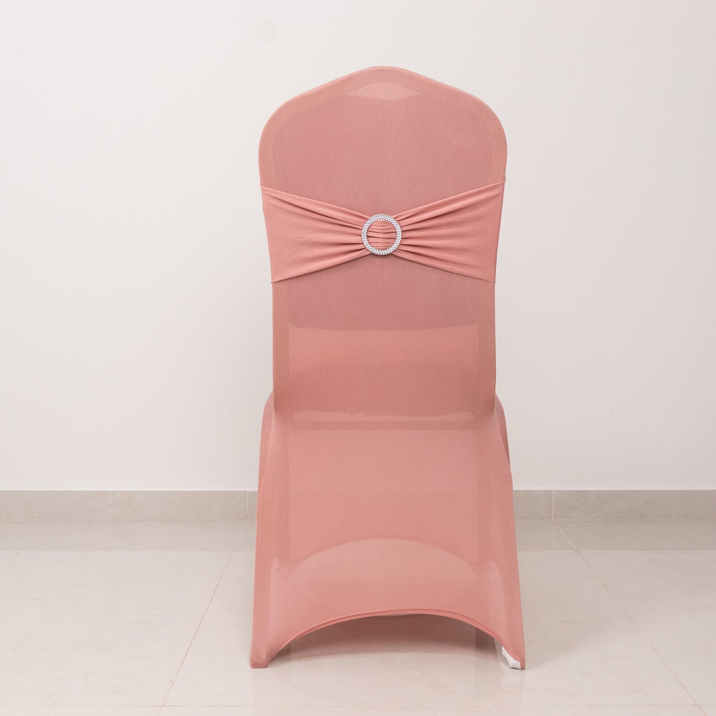 Dusty rose chair cover with silver rhinestone buckle sash.