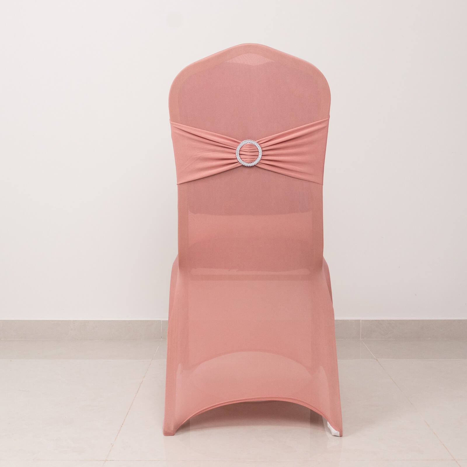 Dusty rose chair cover with silver rhinestone buckle sash.
