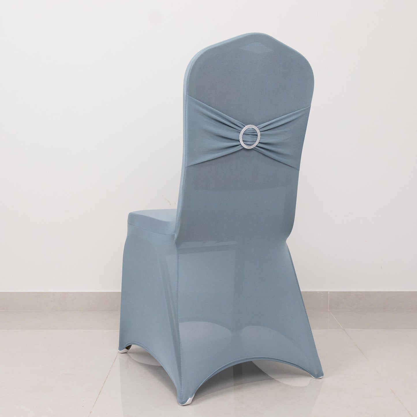 Dusty blue banquet chair cover with silver rhinestone sash.