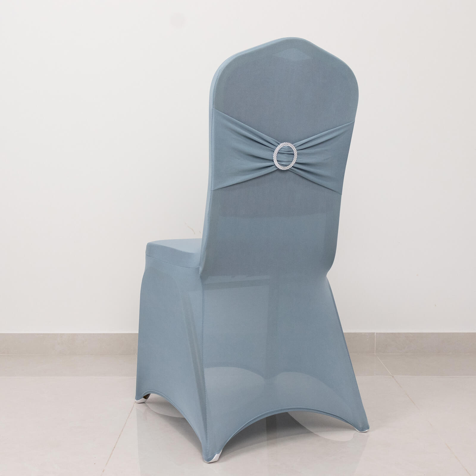 Dusty blue banquet chair cover with silver rhinestone sash.
