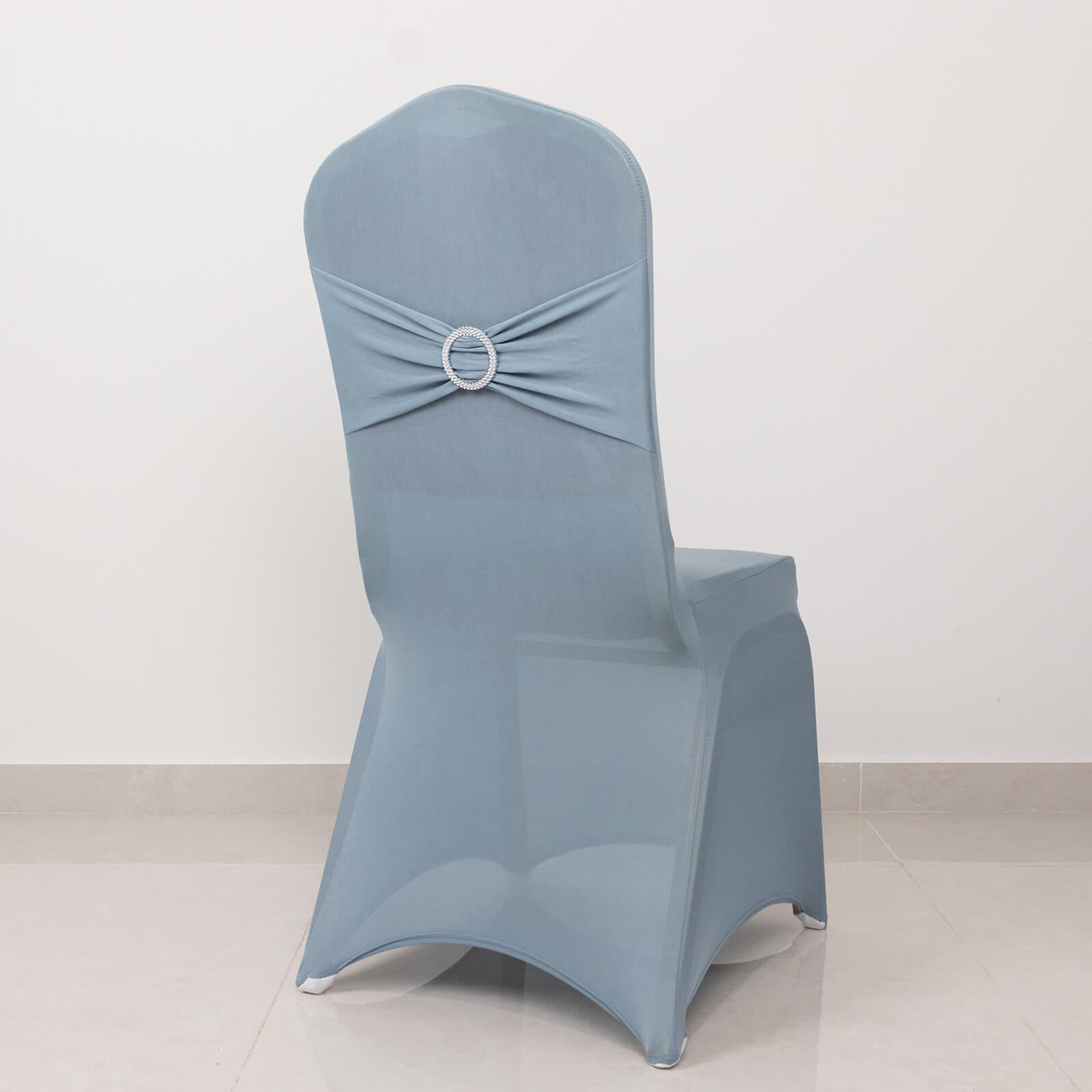 Dusty blue spandex banquet chair cover with silver rhinestone buckle.