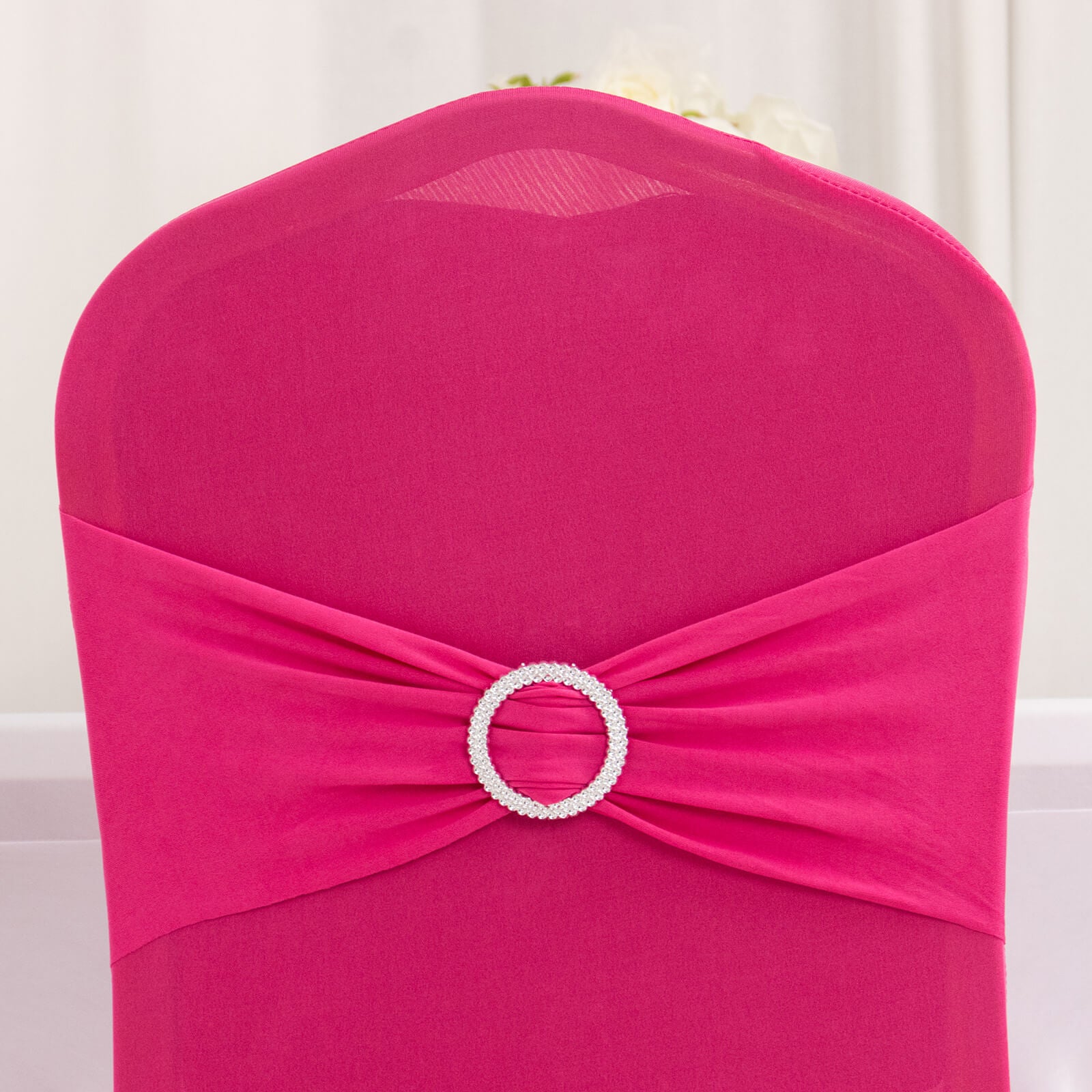 Fuchsia banquet chair cover with silver rhinestone sash band.