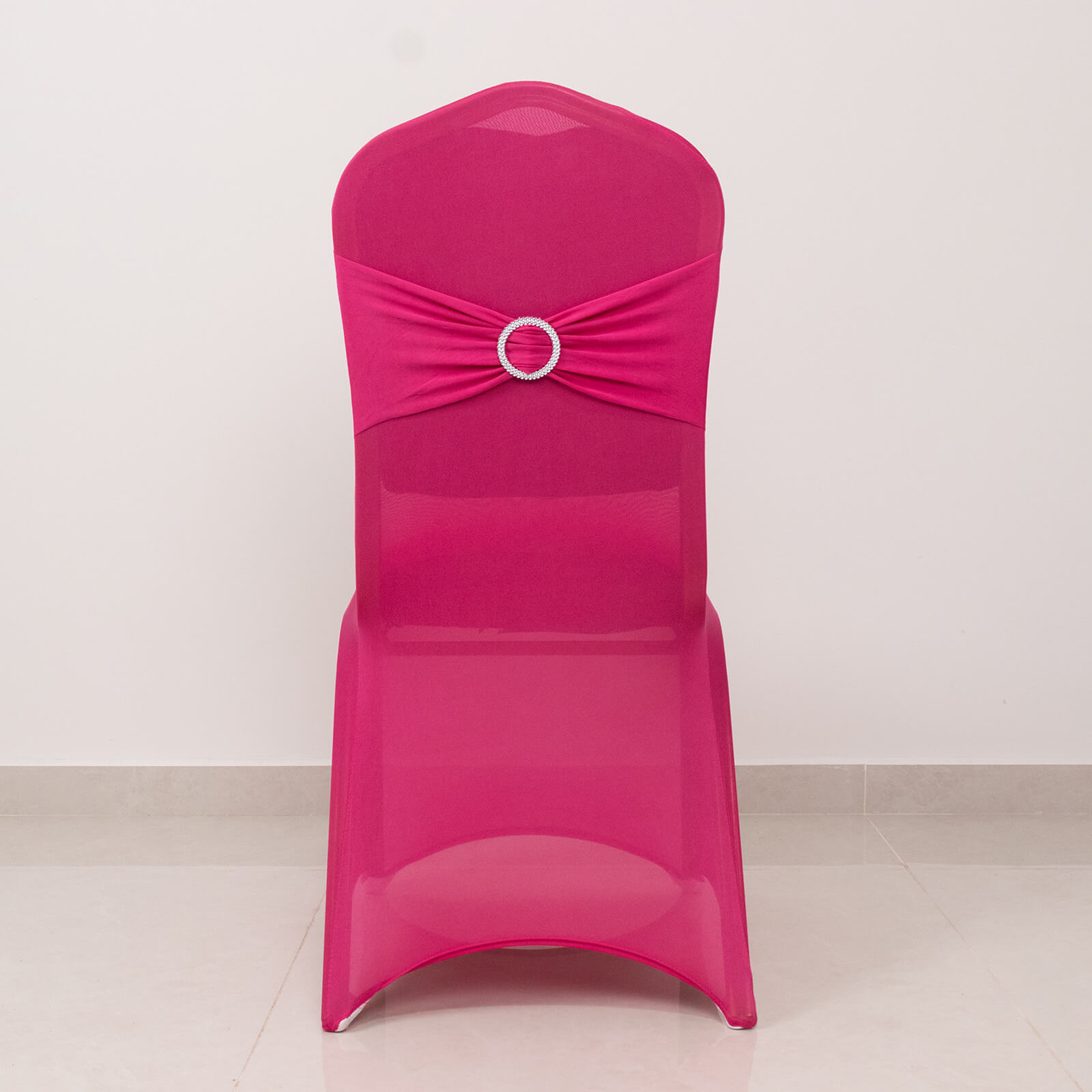 Fuchsia banquet chair cover with silver rhinestone buckle sash.