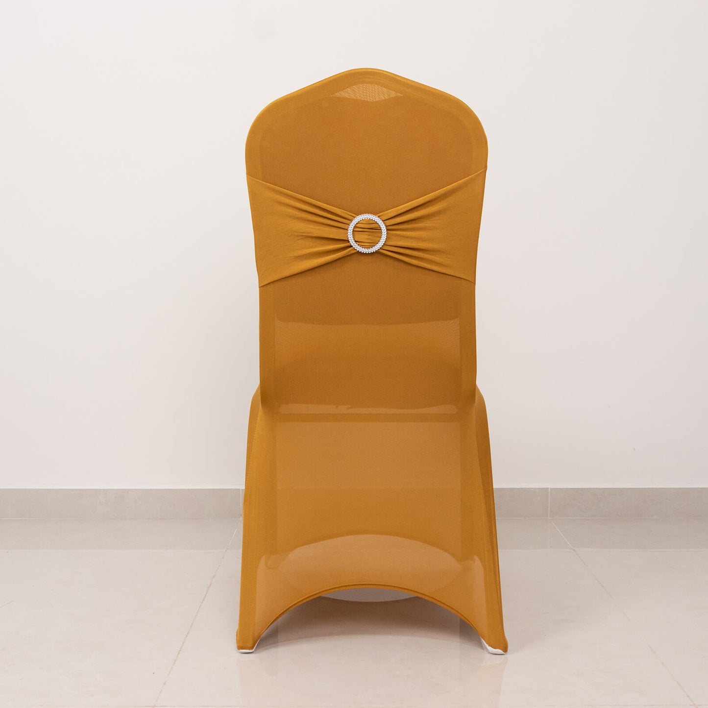 Gold chair cover with silver rhinestone sash.