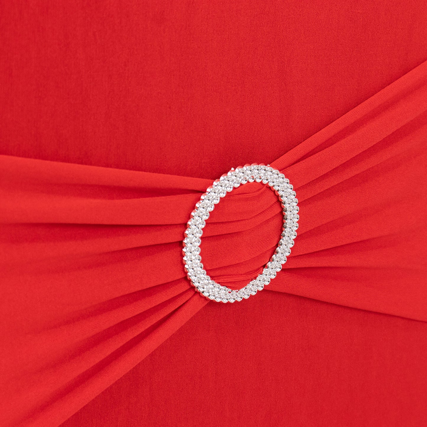 Red spandex banquet chair cover with silver rhinestone buckle.