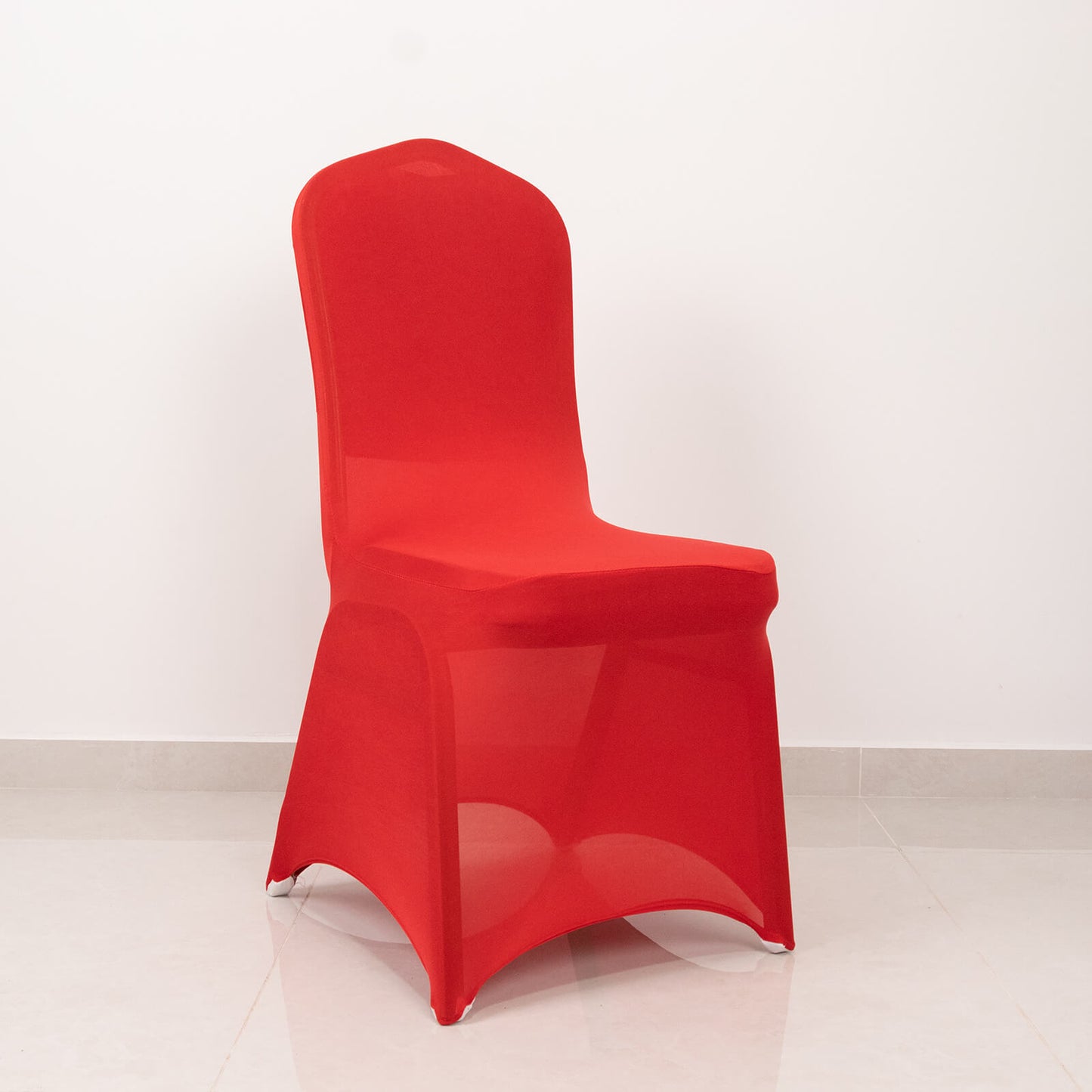Red spandex banquet chair cover with silver rhinestone sash.