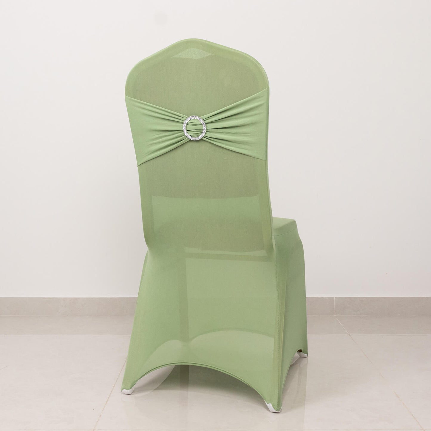 Sage green banquet chair cover with silver rhinestone sash.