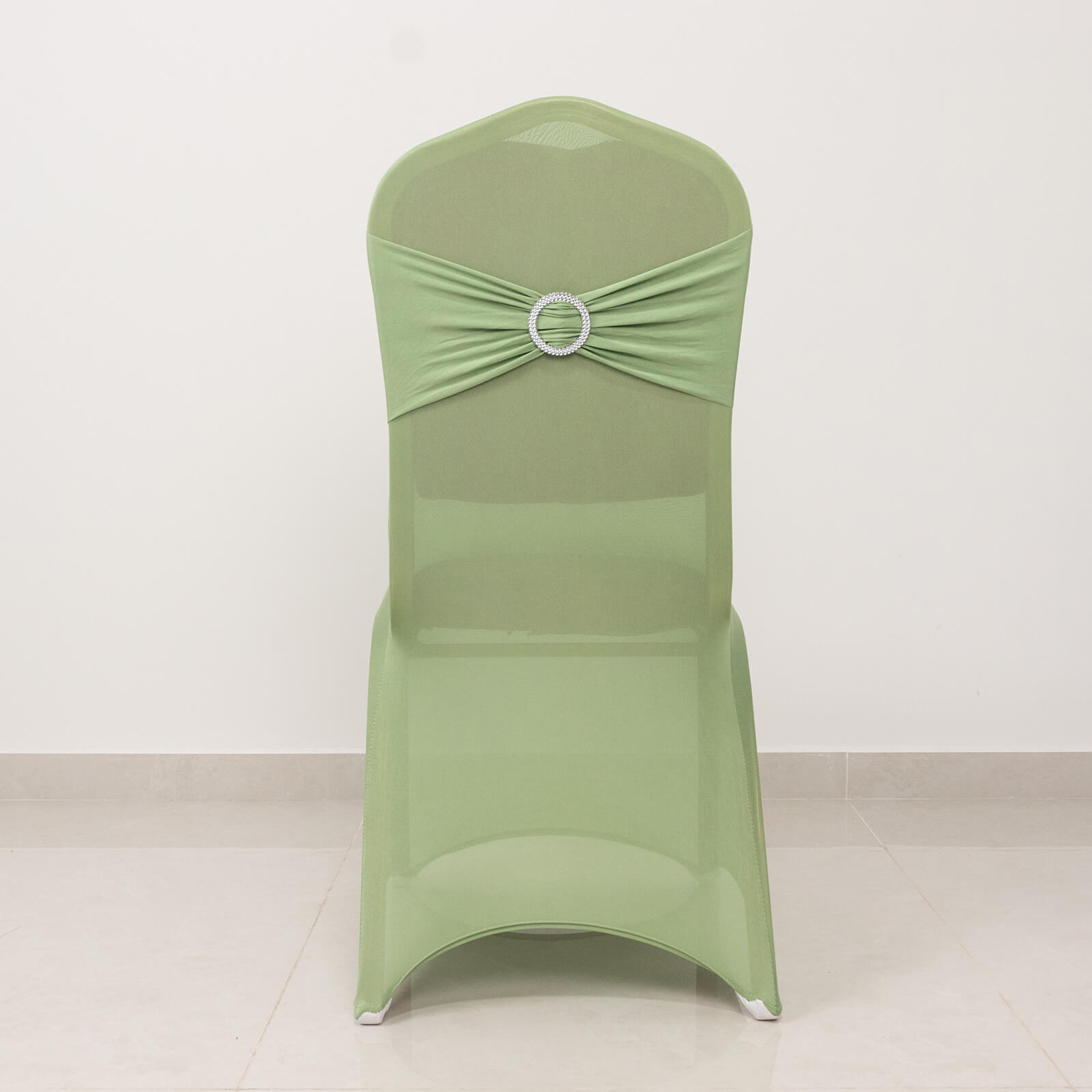 Sage green spandex banquet chair cover with silver rhinestone sash.