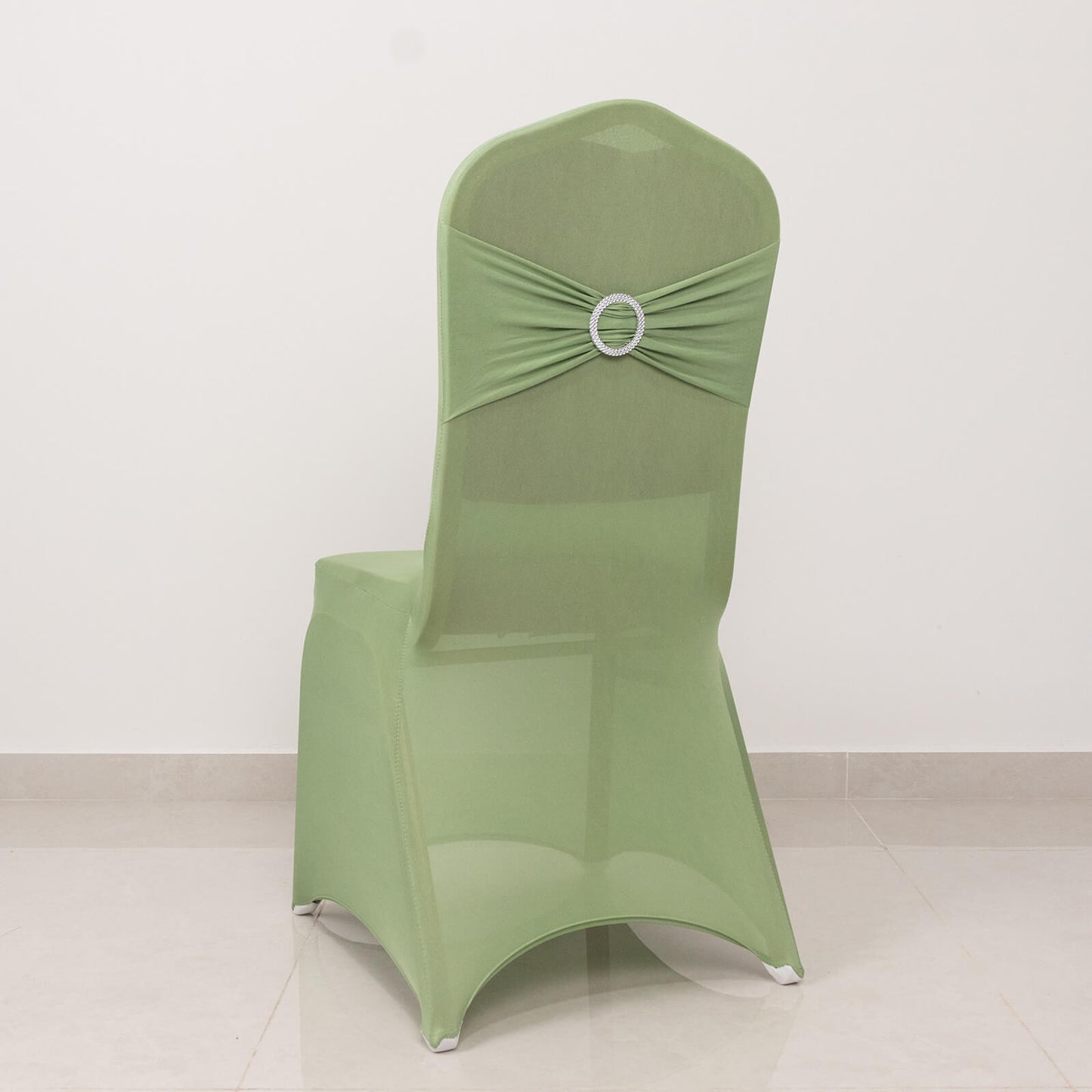 Sage green spandex banquet chair cover with silver rhinestone sash.