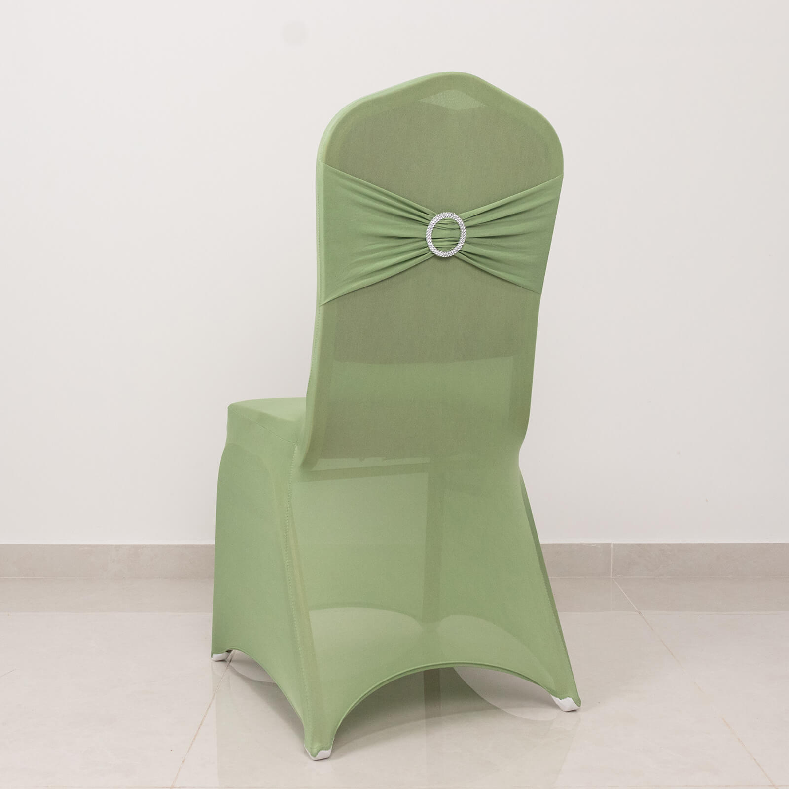 Sage green spandex banquet chair cover with silver rhinestone sash.