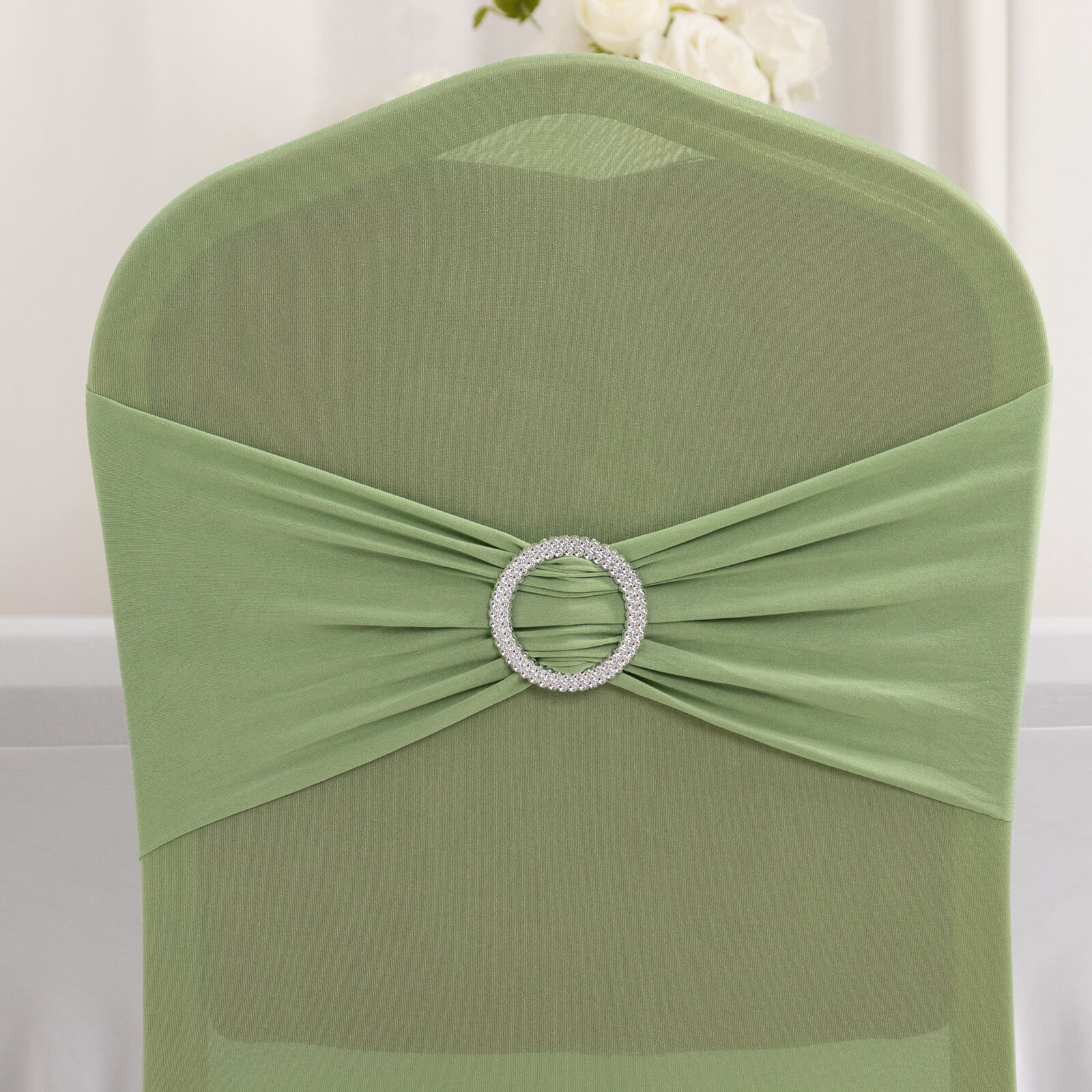 Sage green banquet chair cover with silver rhinestone sash.