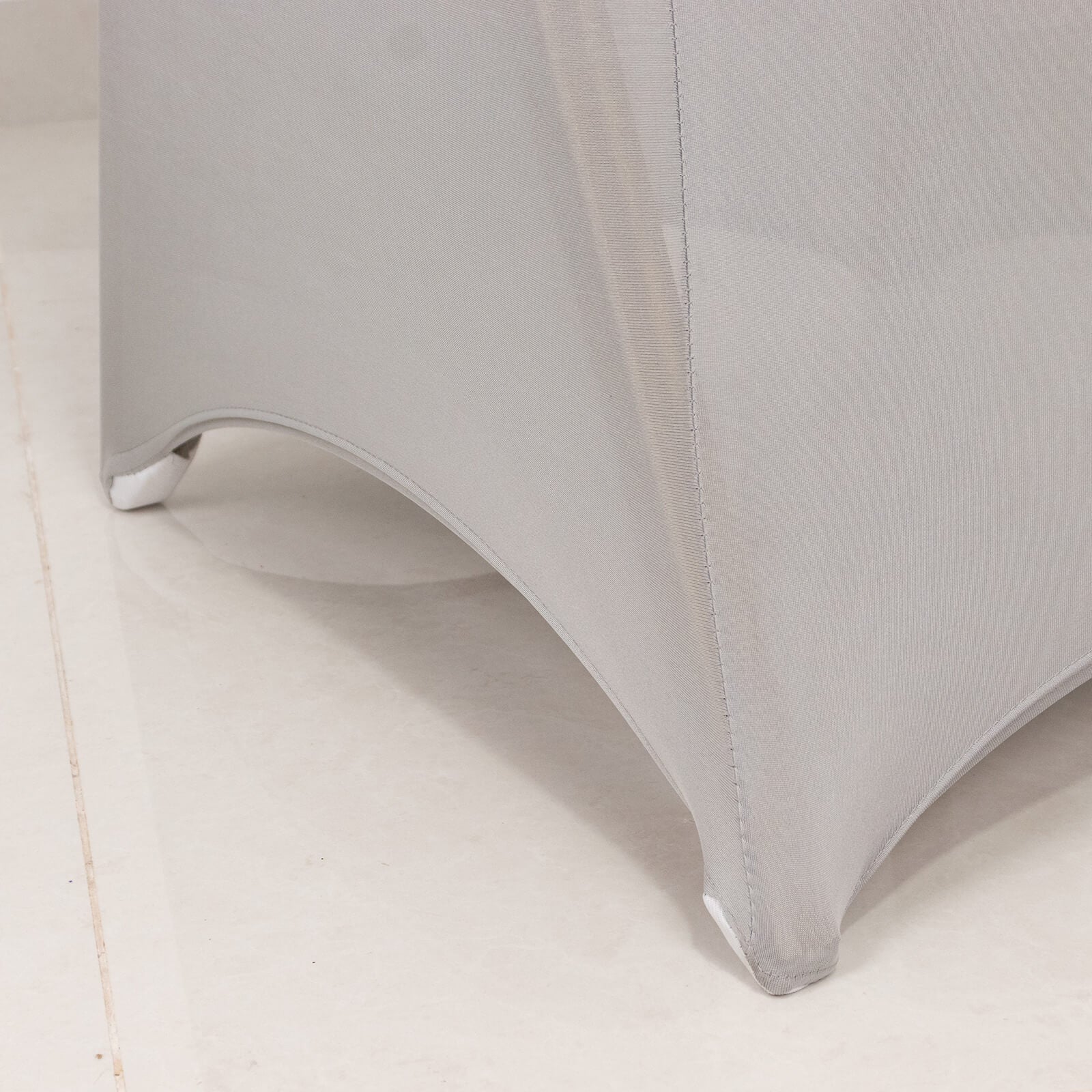 Silver spandex banquet chair cover with rhinestone sash band.