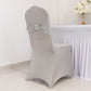 Silver spandex banquet chair cover with rhinestone buckle on a fitted chair.