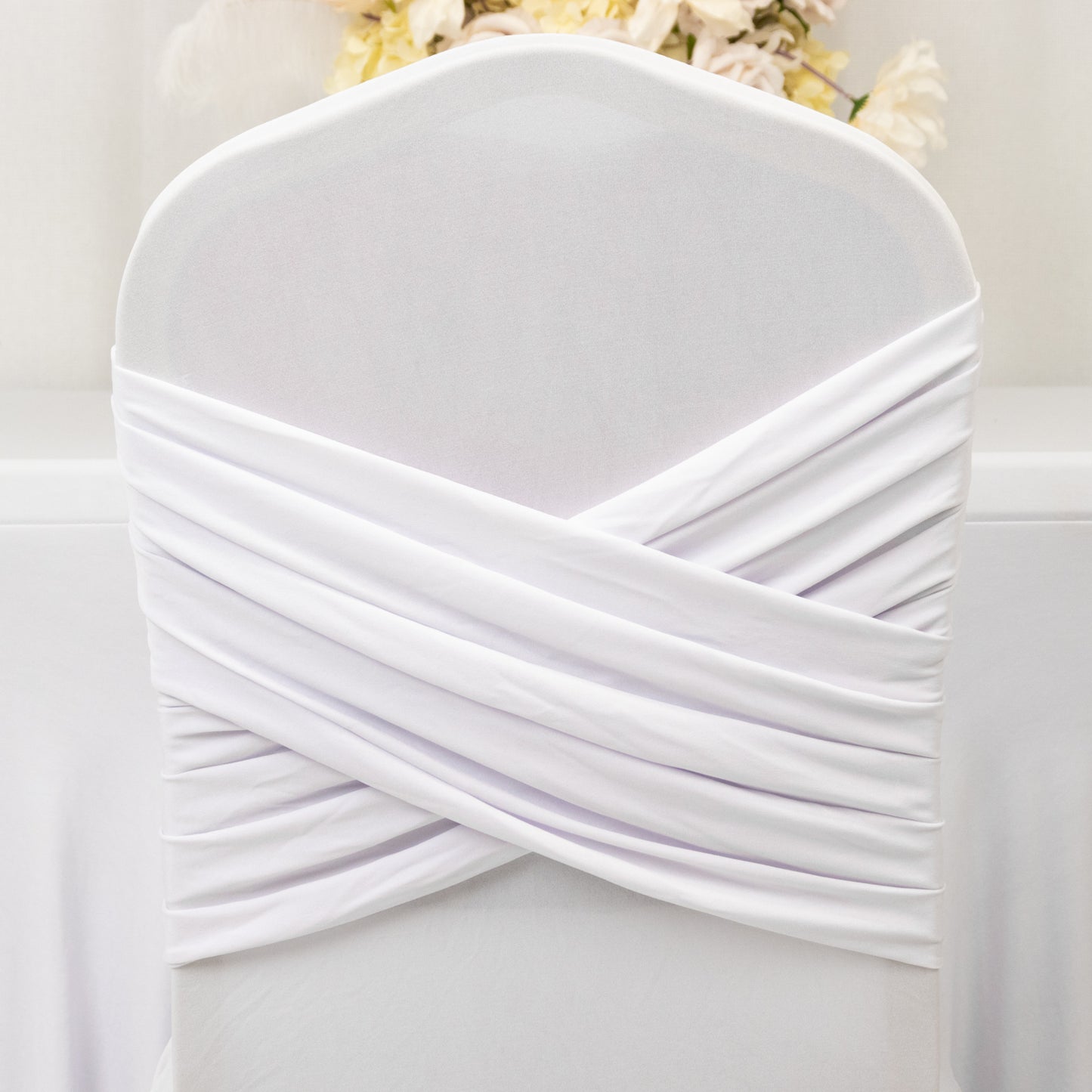 White Spandex Banquet Chair Cover with Ruffle Skirt & Cross Back Sash – Stretch Slipcover for Events